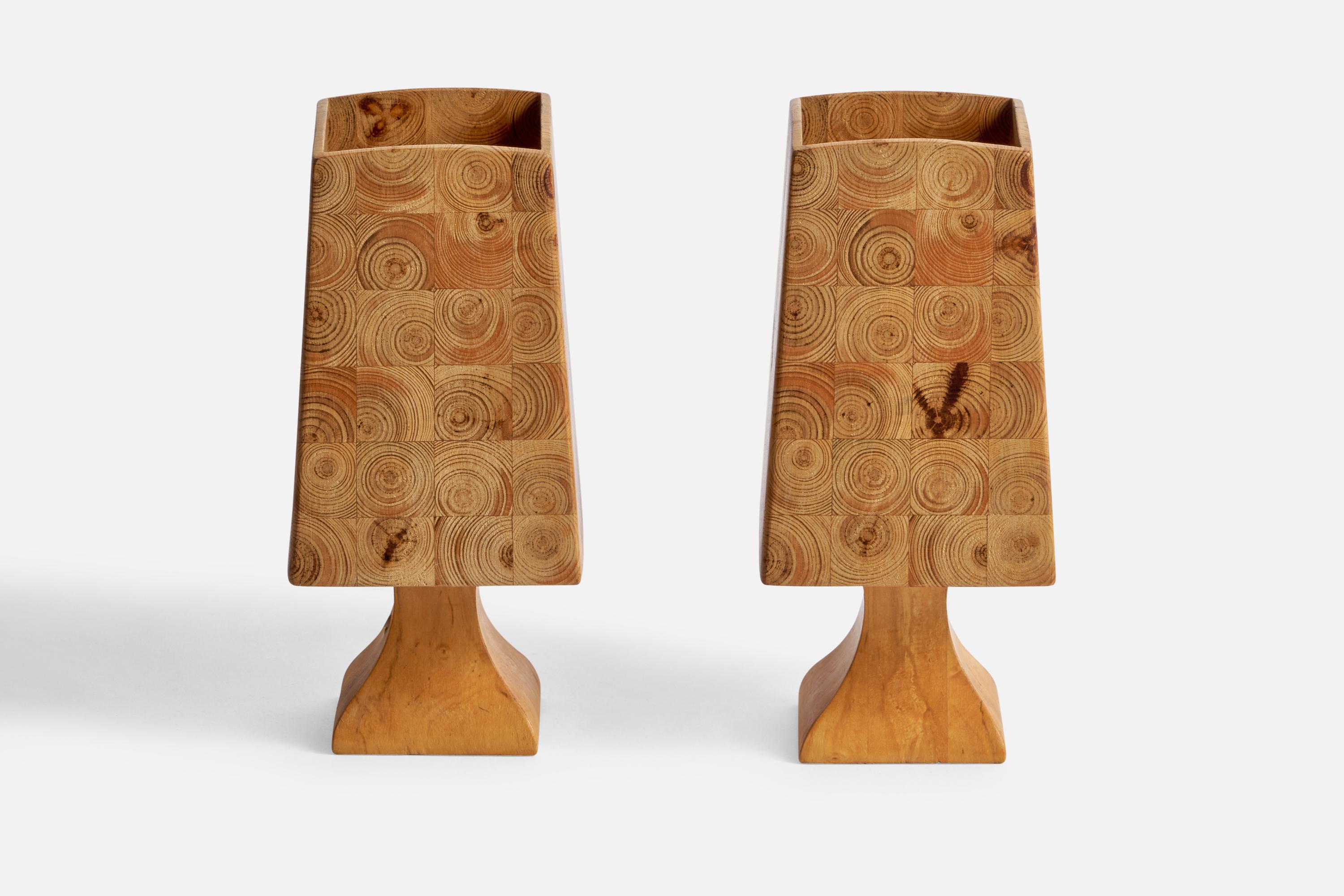 A pair of pine table lamps designed and produced in Sweden, 1970s.

Overall Dimensions (inches): 7.35” H x 3.3” W x 3.3” D
Bulb Specifications: E-14 Bulb
Number of Sockets: 2
All lighting will be converted for US usage. We are unable to confirm that