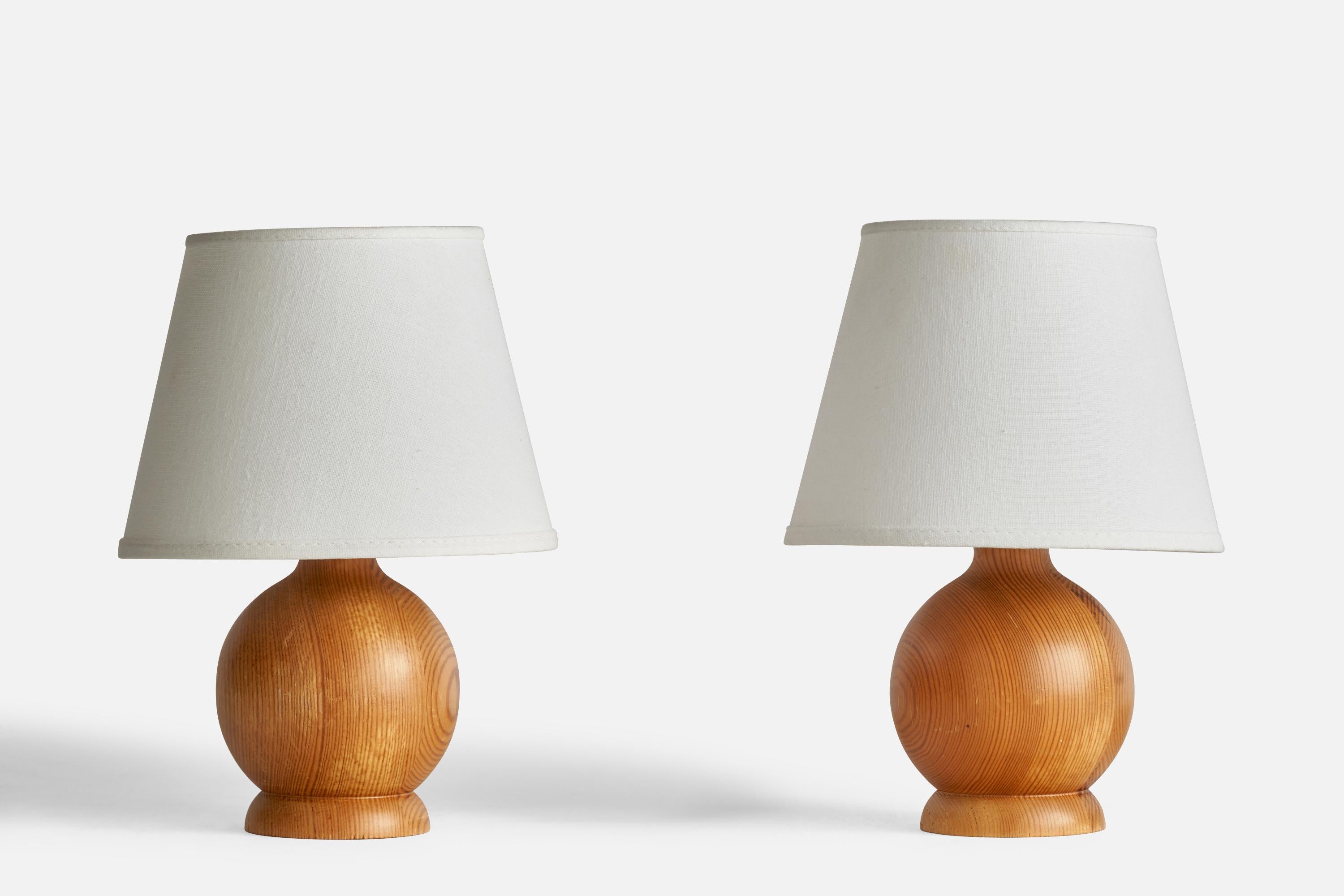 A pair of pine table lamps designed and produced in Sweden, 1970s.

Dimensions of Lamp (inches): 8.6” H x 4.45” Diameter
Dimensions of Shade (inches): 5” Top Diameter x 8” Bottom Diameter x 6” H
Dimensions of Lamp with Shade (inches): 12” H x 8”
