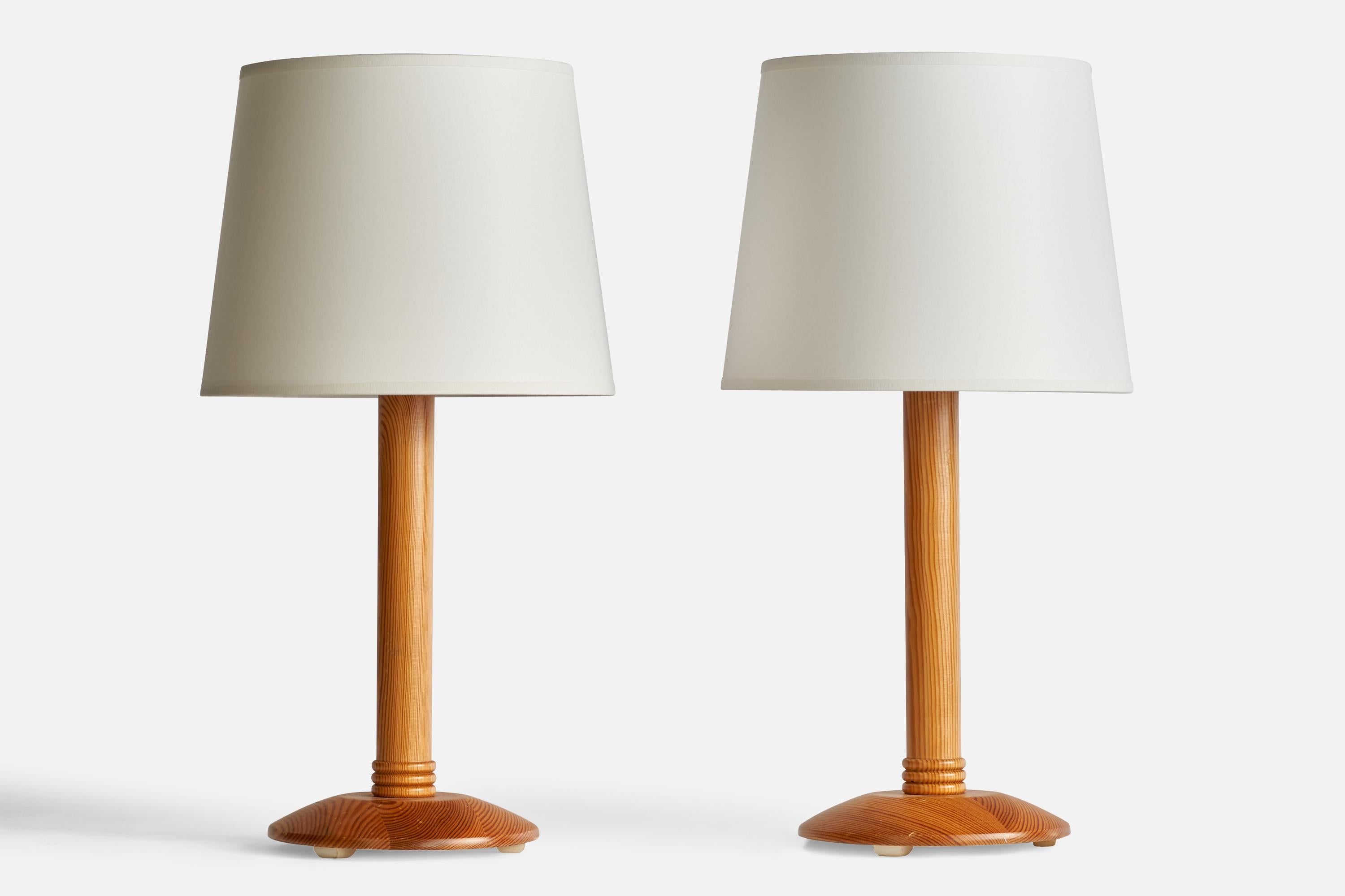 A pair of pine table lamps designed and produced in Sweden, c. 1970s.

Dimensions of Lamp (inches): 13.5” H x 6.5” Diameter
Dimensions of Shade (inches): 8” Top Diameter x 10” Bottom Diameter x 8” H
Dimensions of Lamp with Shade (inches): 19.25” H x