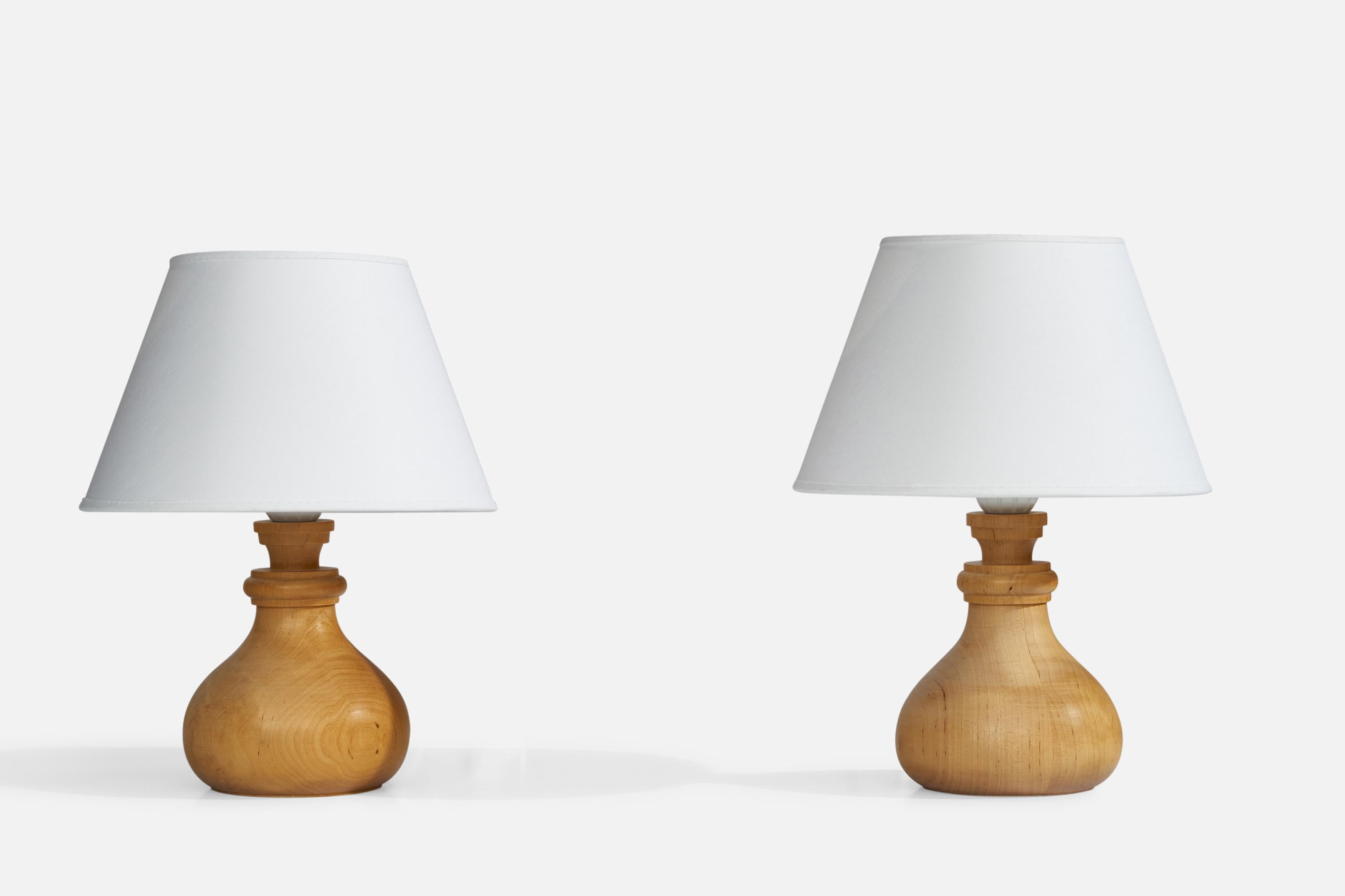 A pair of pine table lamps designed and produced in Sweden, dated 1978.

Dimensions of Lamp (inches): 7.75”  H x 4.5” Diameter
Dimensions of Shade (inches): 4.75”  Top Diameter x 8.25” Bottom Diameter x 5.25” H
Dimensions of Lamp with Shade