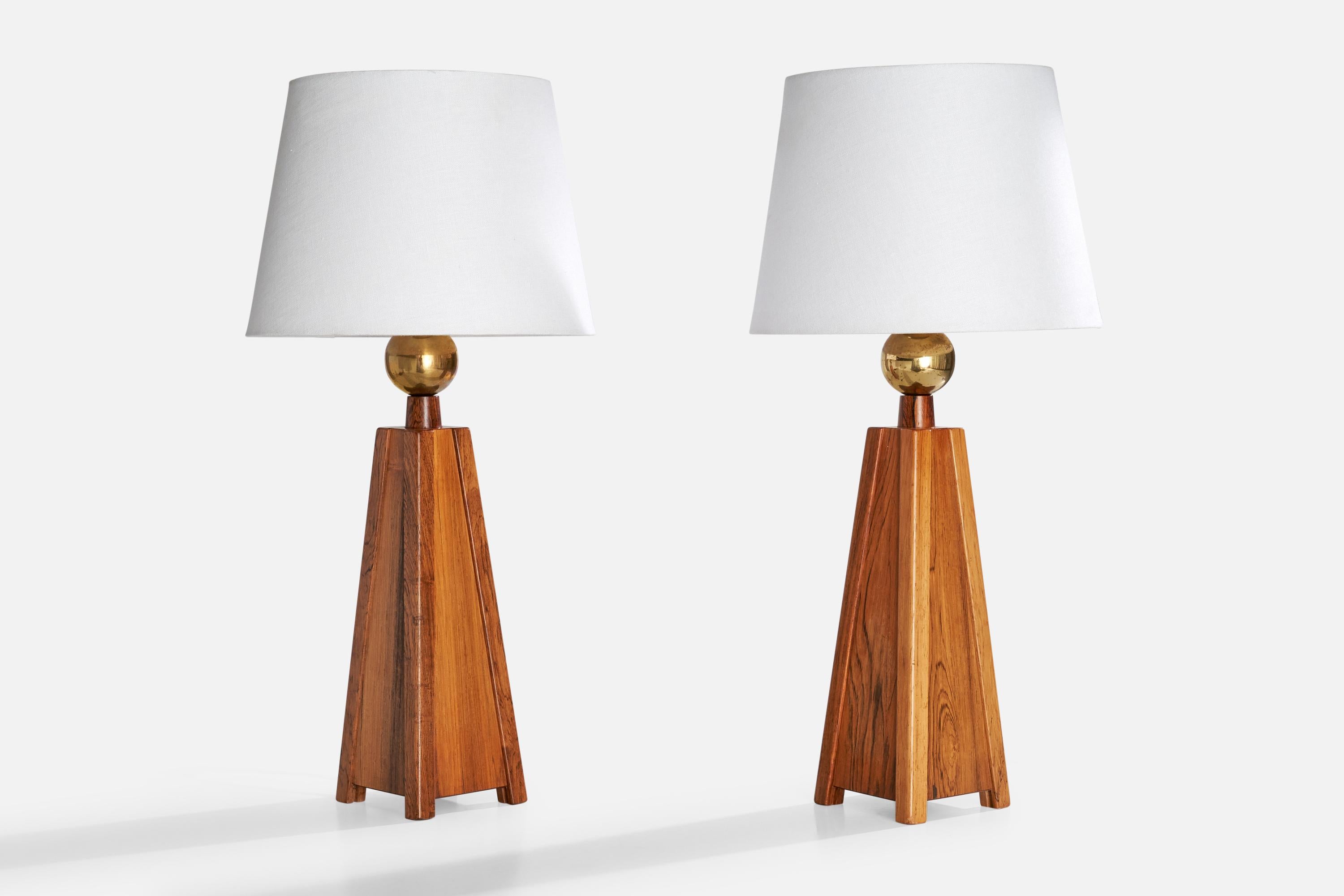 A pair of brass and rosewood table lamps designed and produced in Sweden, c. 1950s.

Dimensions of Lamp (inches): 19.875“ H x 5” Diameter

Dimensions of Shade (inches): 9” Top Diameter x 12” Bottom Diameter x 9“ H

Dimensions of Lamp with Shade
