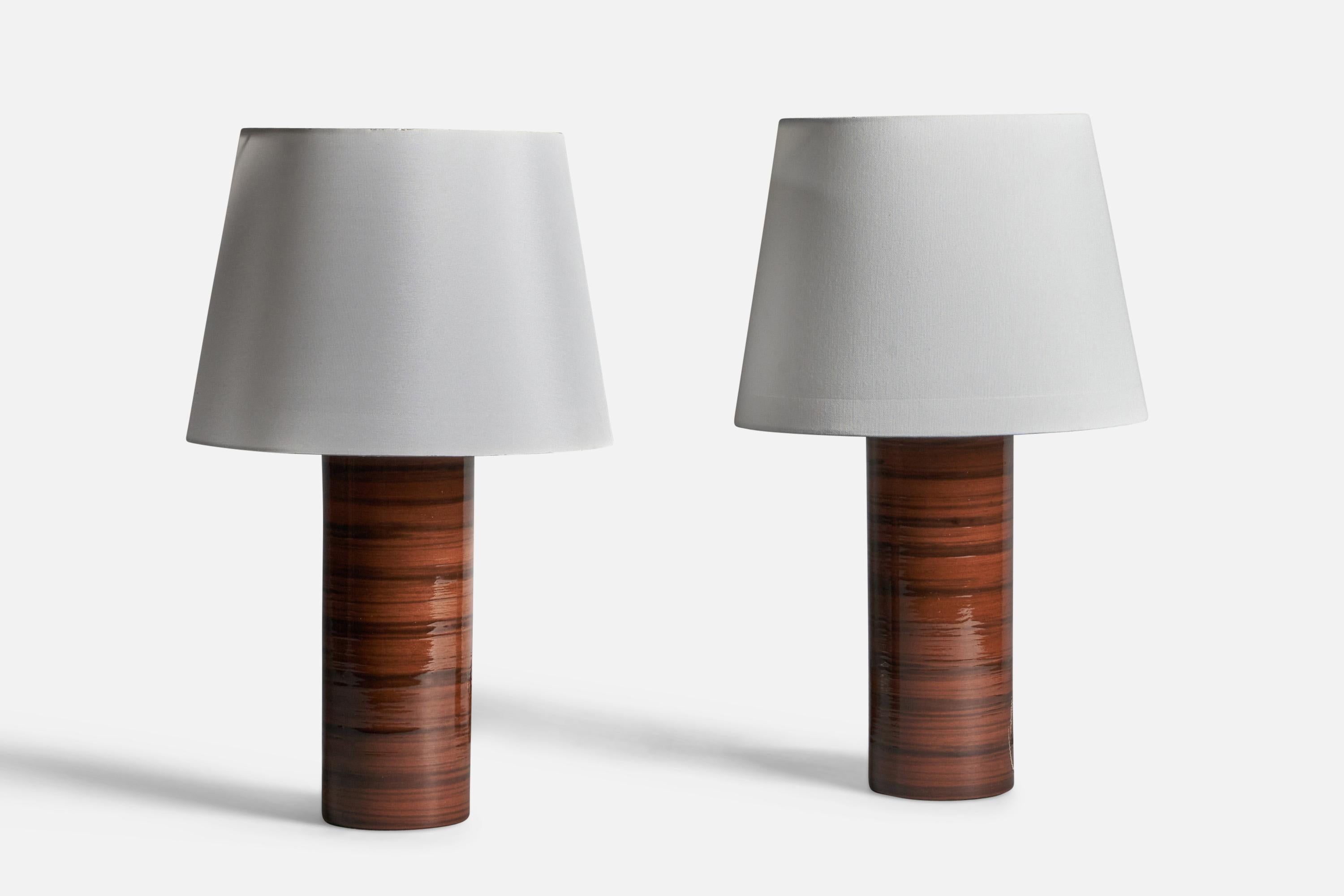 A pair of brown and black-glazed stoneware table lamps, designed and produced in Sweden, 1960s.

Dimensions of Lamp (inches): 14.5