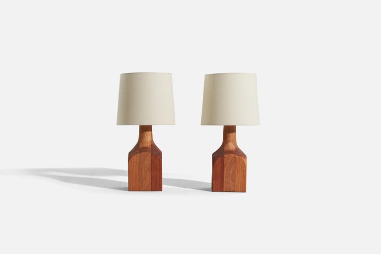 A pair of wooden table lamps, designed and produced by a Swedish designer, Sweden, c. 1970s.

Sold without lampshade. 
Dimensions of lamp (inches) : 11.75 x 4.125 x 4.125 (H x W x D)
Dimensions of shade (inches) : 7 x 8 x 7 (T x B x
