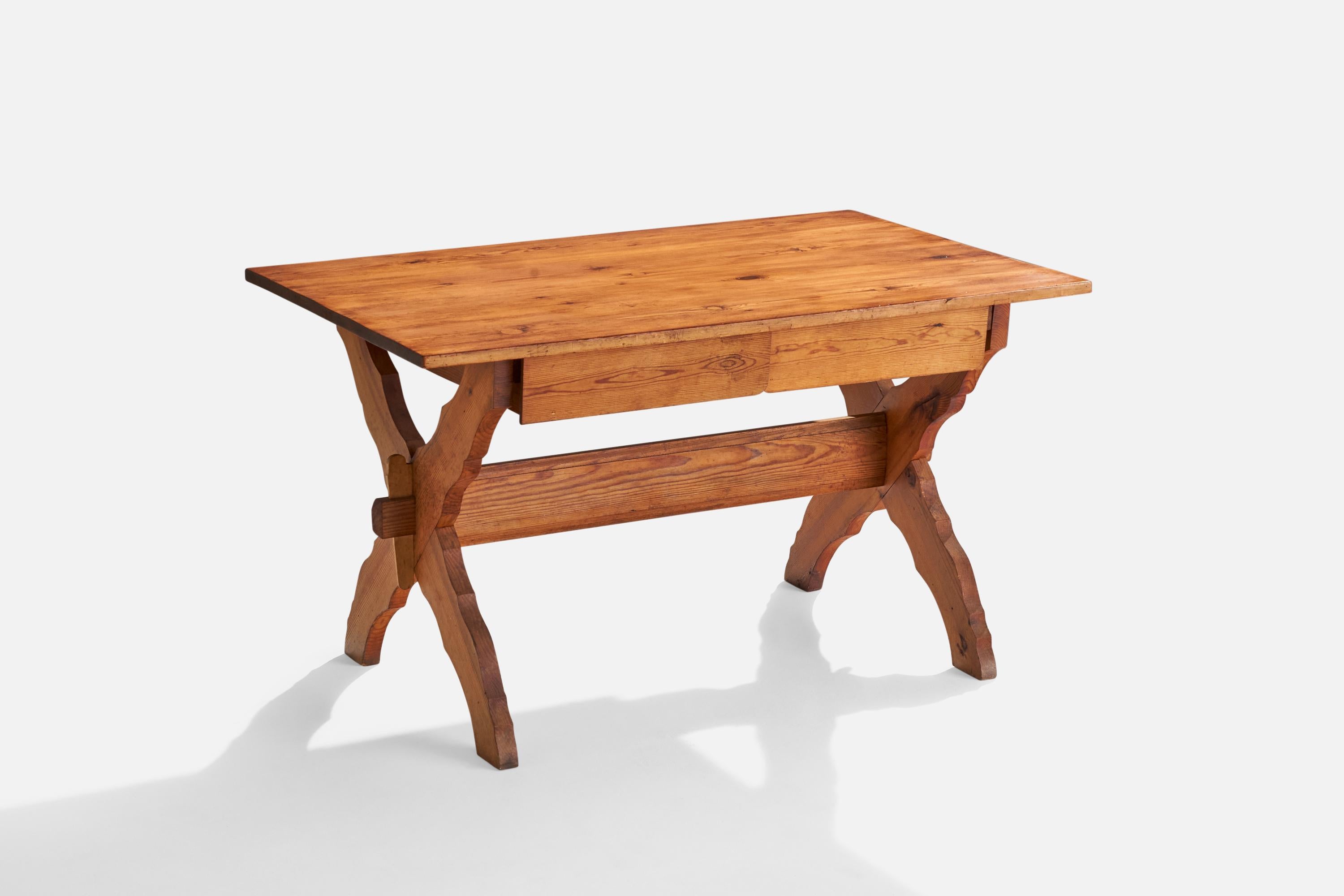 A pine table or desk designed and produced in Sweden, c. 1920s.