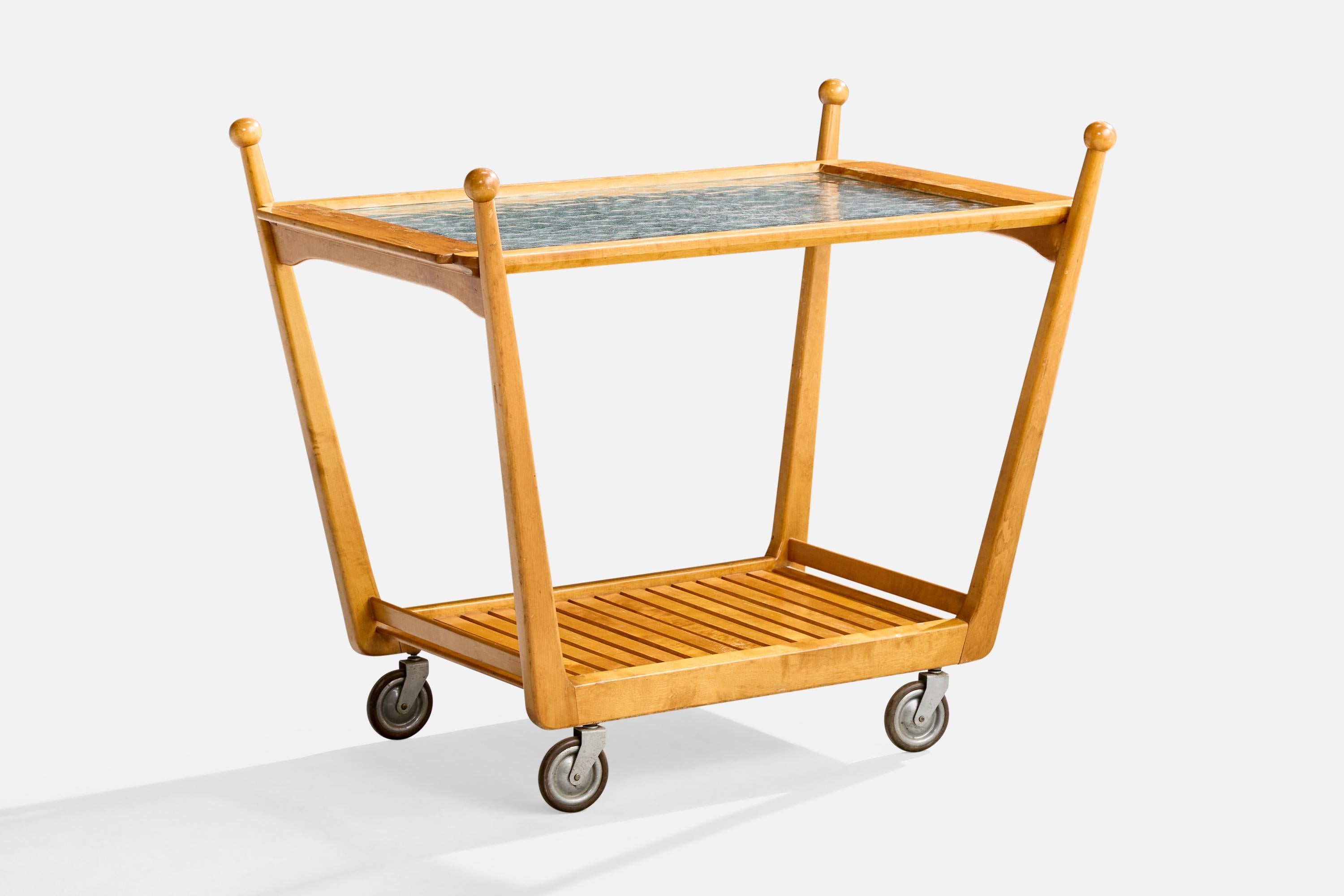 Carrito de té o carrito de bar de abedul, cristal y metal, diseñado y fabricado en Suecia, c. década de 1940.

Dimensiones totales (pulgadas): 27,25 