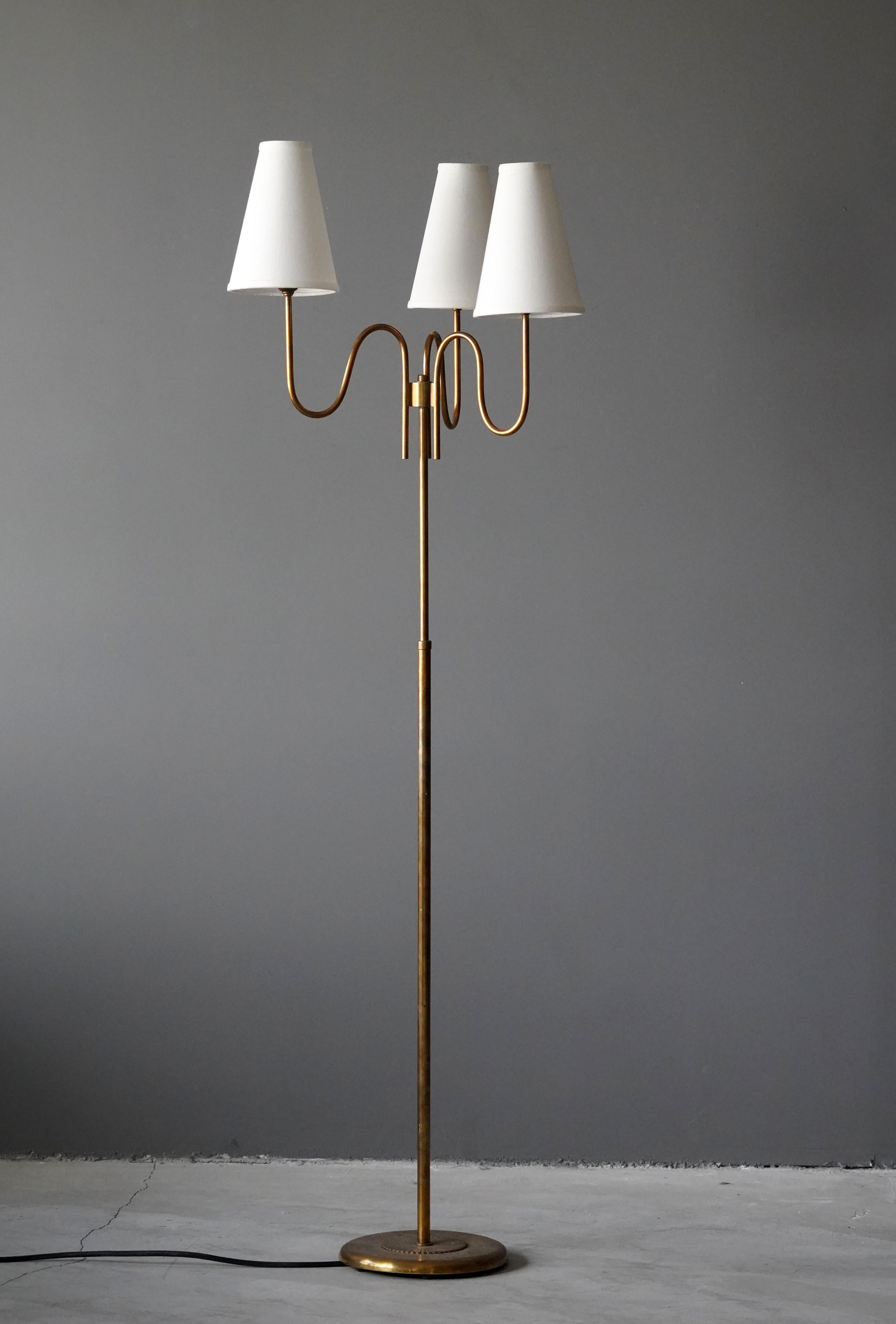 A three-armed floor lamp. By an unknown Swedish designer and maker. In brass. 

Adjustable height, measured as illustrated.

Other designers working in the organic style include Jean Royere, Alvar Aalto, Paavo Tynell, Josef Frank, and Serge