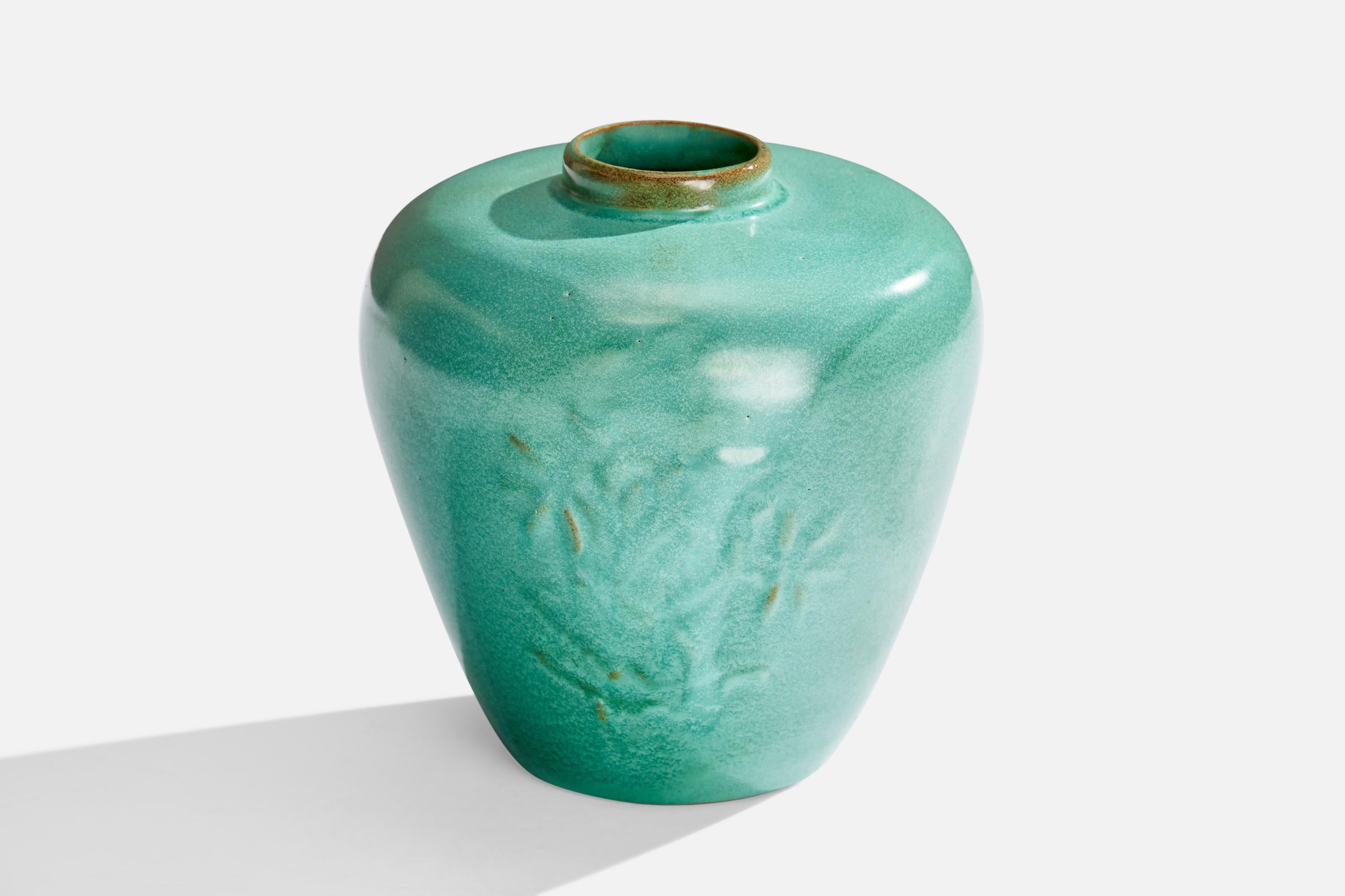 A green-glazed ceramic vase designed and produced in Sweden, 1930s.