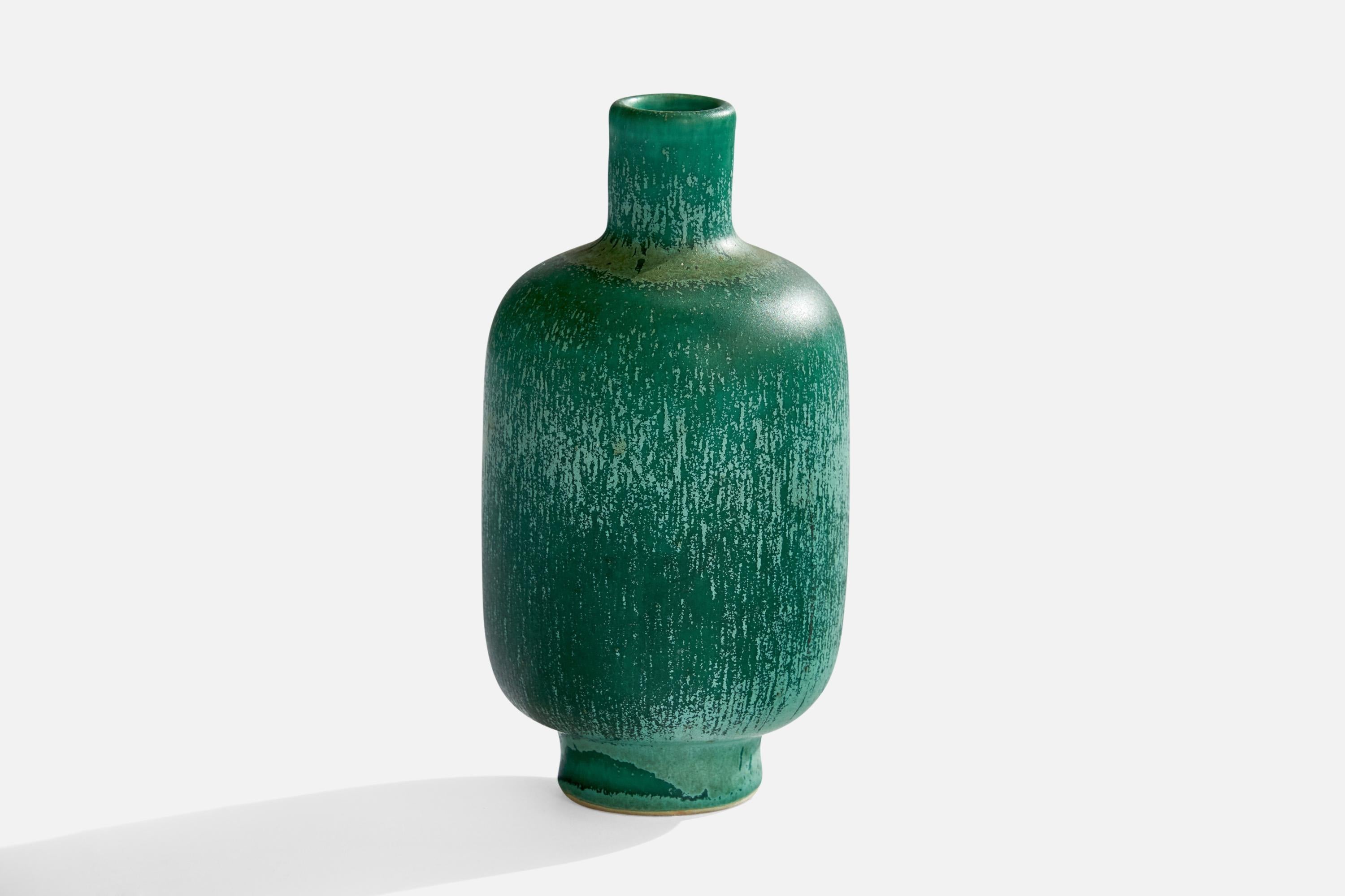 A green-glazed ceramic vase designed and produced in Sweden, 1950s.