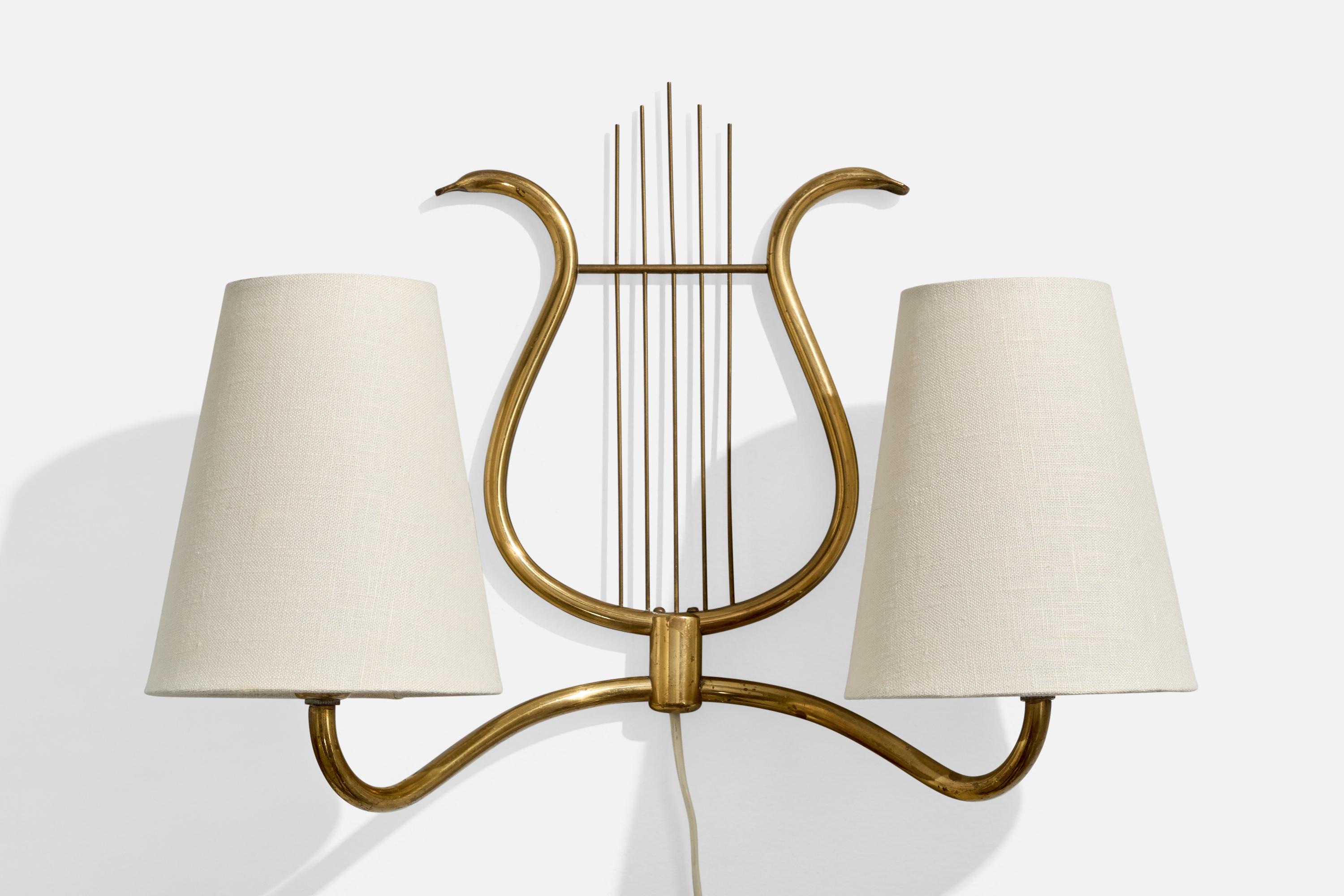 A brass and white fabric wall light designed and produced in Sweden, c. 1940s.

Overall Dimensions (Inches): 10” H x 15.4” W x 7” D

Back Plate Dimensions (Inches): no back plate, just two holes to rest on nail

Bulb Specifications: E-12

Number of
