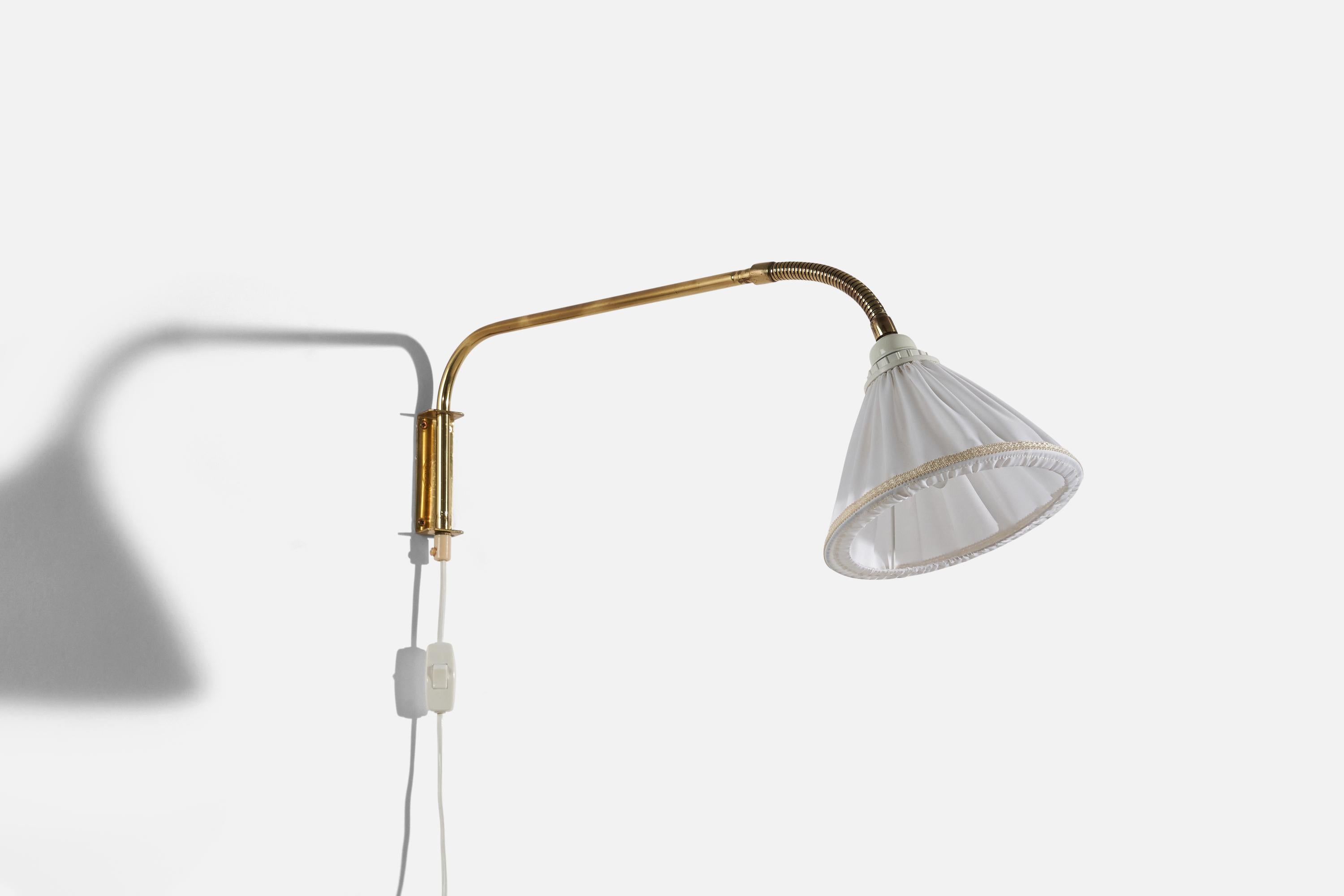 A brass and fabric wall light designed and produced in Sweden, c. 1940s.

Variable dimensions, measured as illustrated in the first image. 

Dimensions of back plate (inches) : 4.125 x 1.375 x 1.0625 (H x W x D).