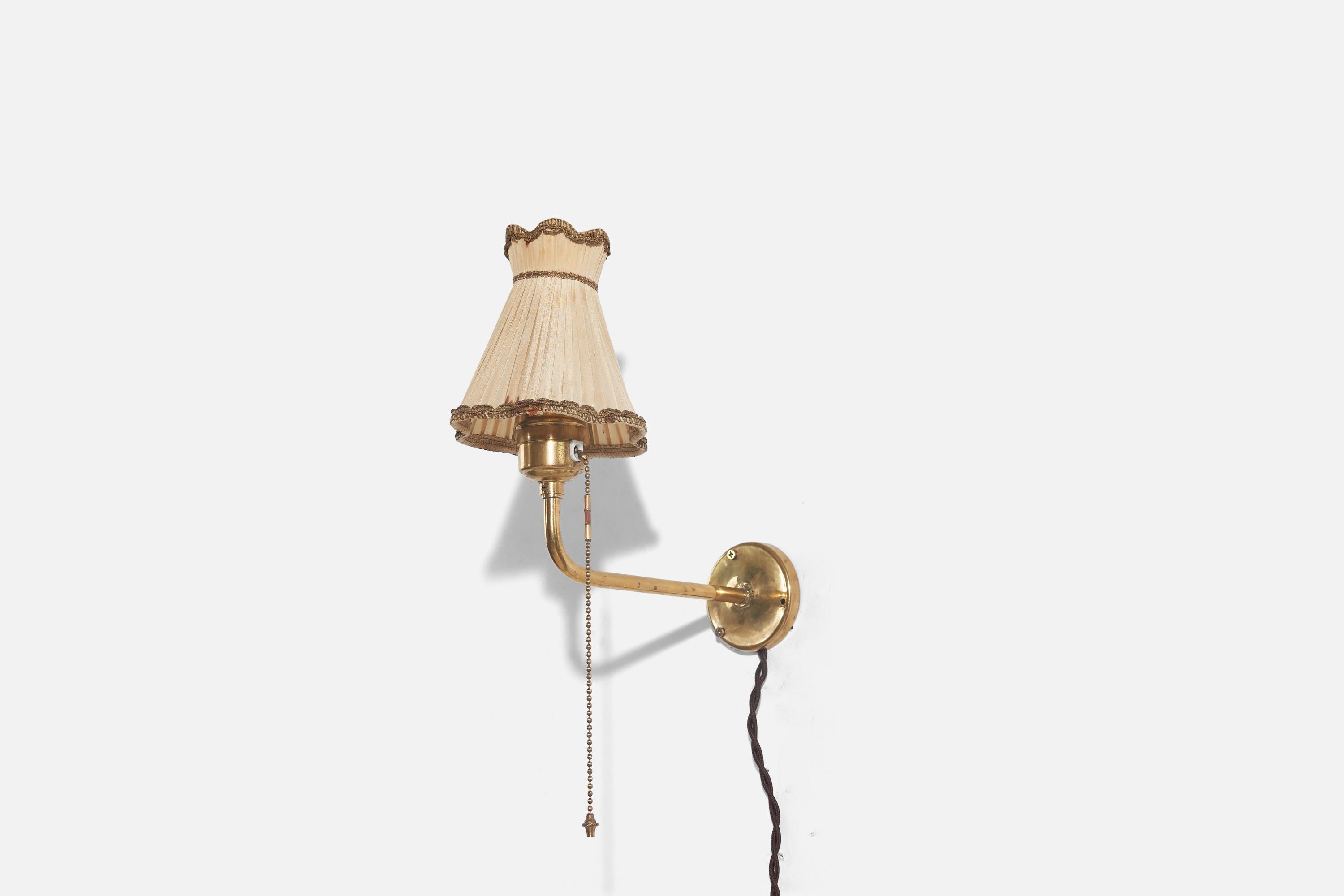 A brass and fabric wall light designed and produced in Sweden, c. 1940s.

Sold with Lampshade. 
Stated dimensions refer to the Sconce with the Shade. 

Dimensions of back plate (inches) : 9.12 x 4.68 x 9.5 (H x W x D).