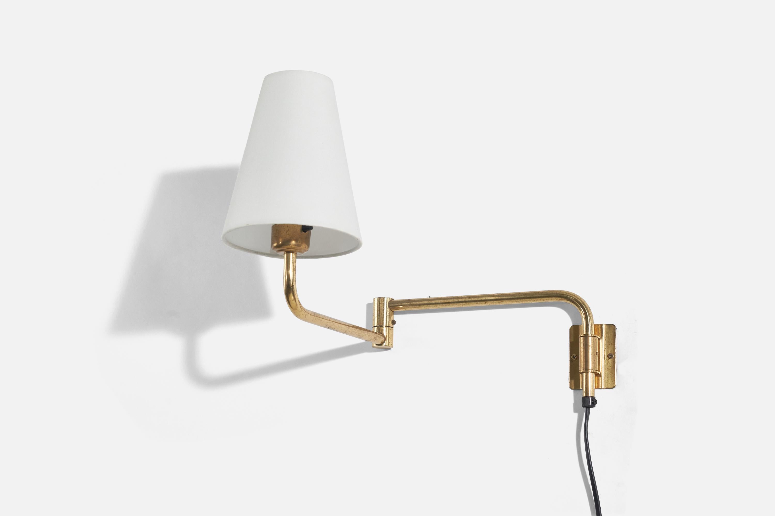 A brass and fabric wall light designed and produced in Sweden, c. 1970s.

Sold with Lampshade. 
Stated dimensions refer to the Sconce with the Shade. 
Variable dimensions. The wall light is measured in its maximum extended position.
 