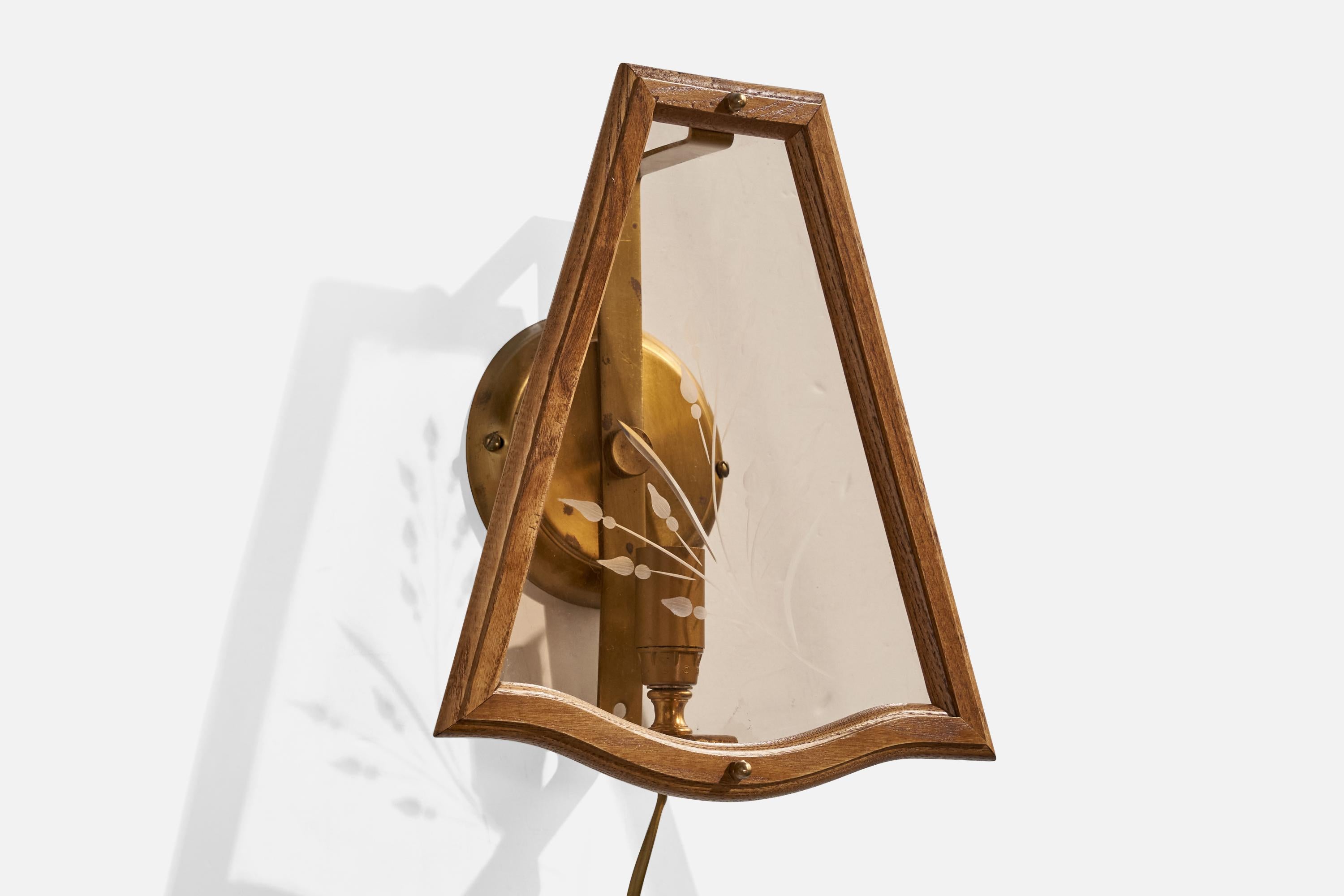 A brass, etched glass and dark-stained oak wall light designed and produced in Sweden, c. 1970s.

Overall Dimensions (inches): 11 ” H x 10 ” W x  4.52“D

Back Plate Dimensions (Inches):  4.75” H x 4.75” W x .75” D

Bulb Specifications: E-14

Number
