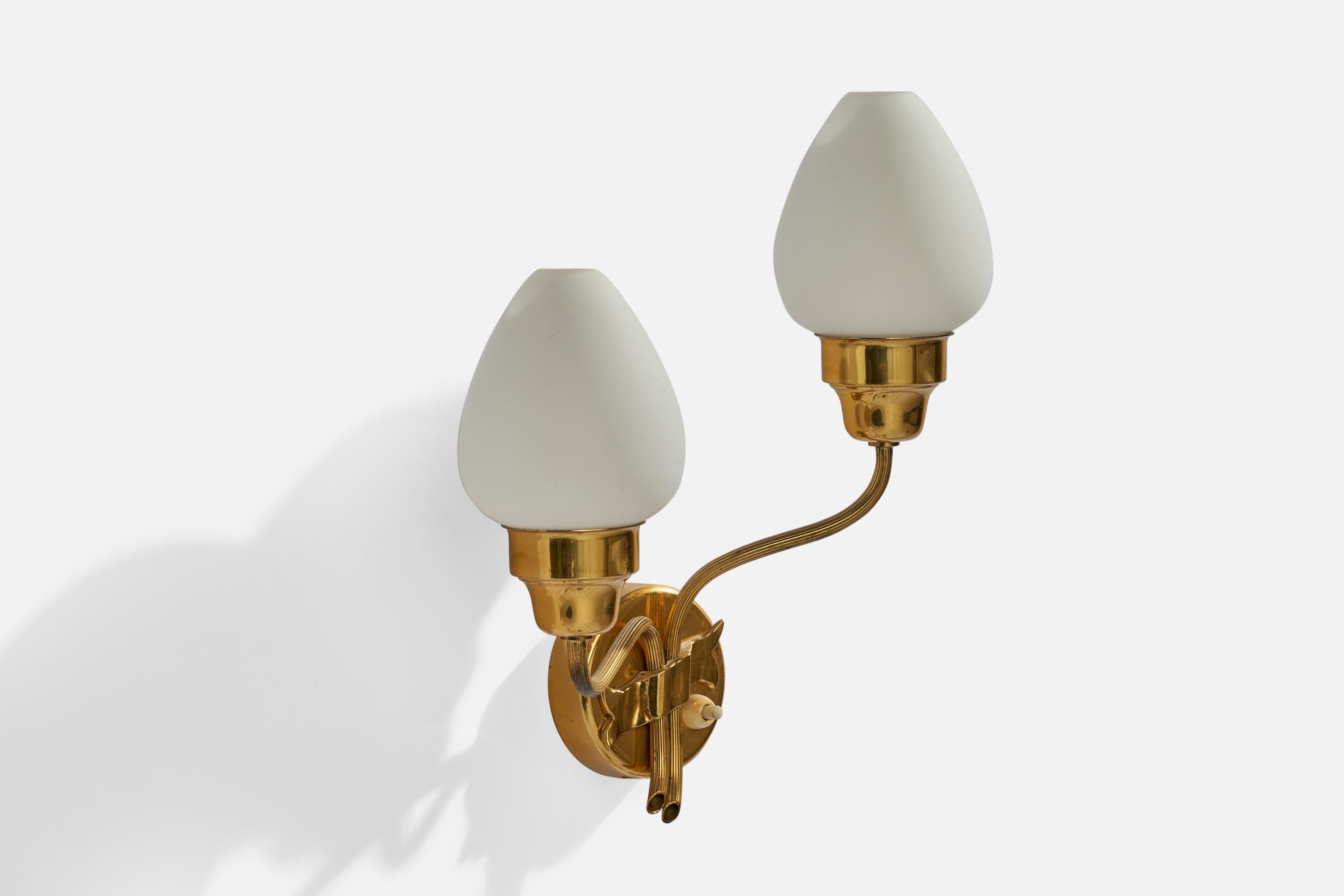 A brass and opaline glass wall light designed and produced in Sweden, c. 1940s.

Overall Dimensions (inches): 12” H x 11.5” W x 5.25” D
Back Plate Dimensions (inches): 3.5” H x 3.5” W x 1.0” D
Bulb Specifications: E-14 Bulb
Number of Sockets: 2
All