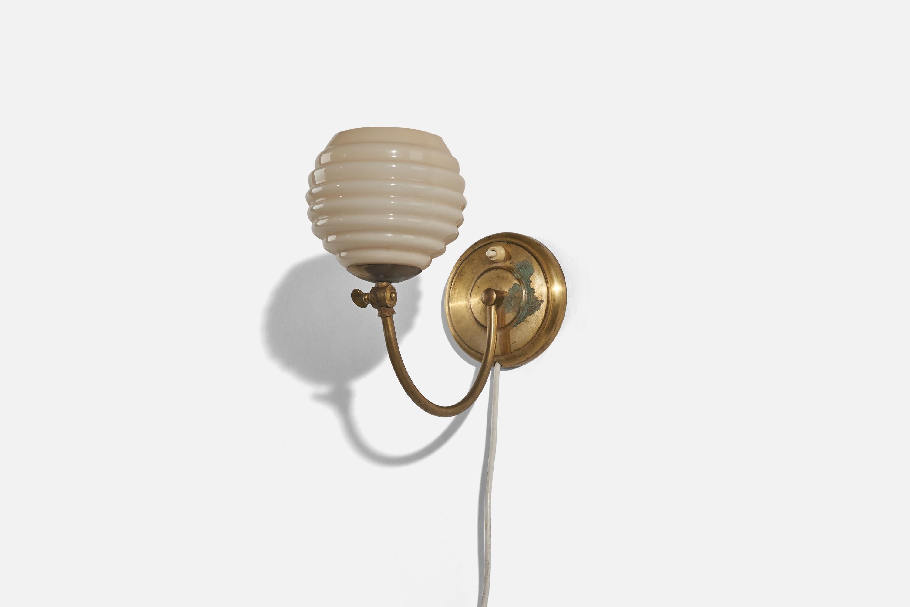 A brass and glass wall light designed and produced in Sweden, c. 1930s. 

Dimensions of back plate (inches) : 4.875 x 4.875 x .875 (H x W x D).