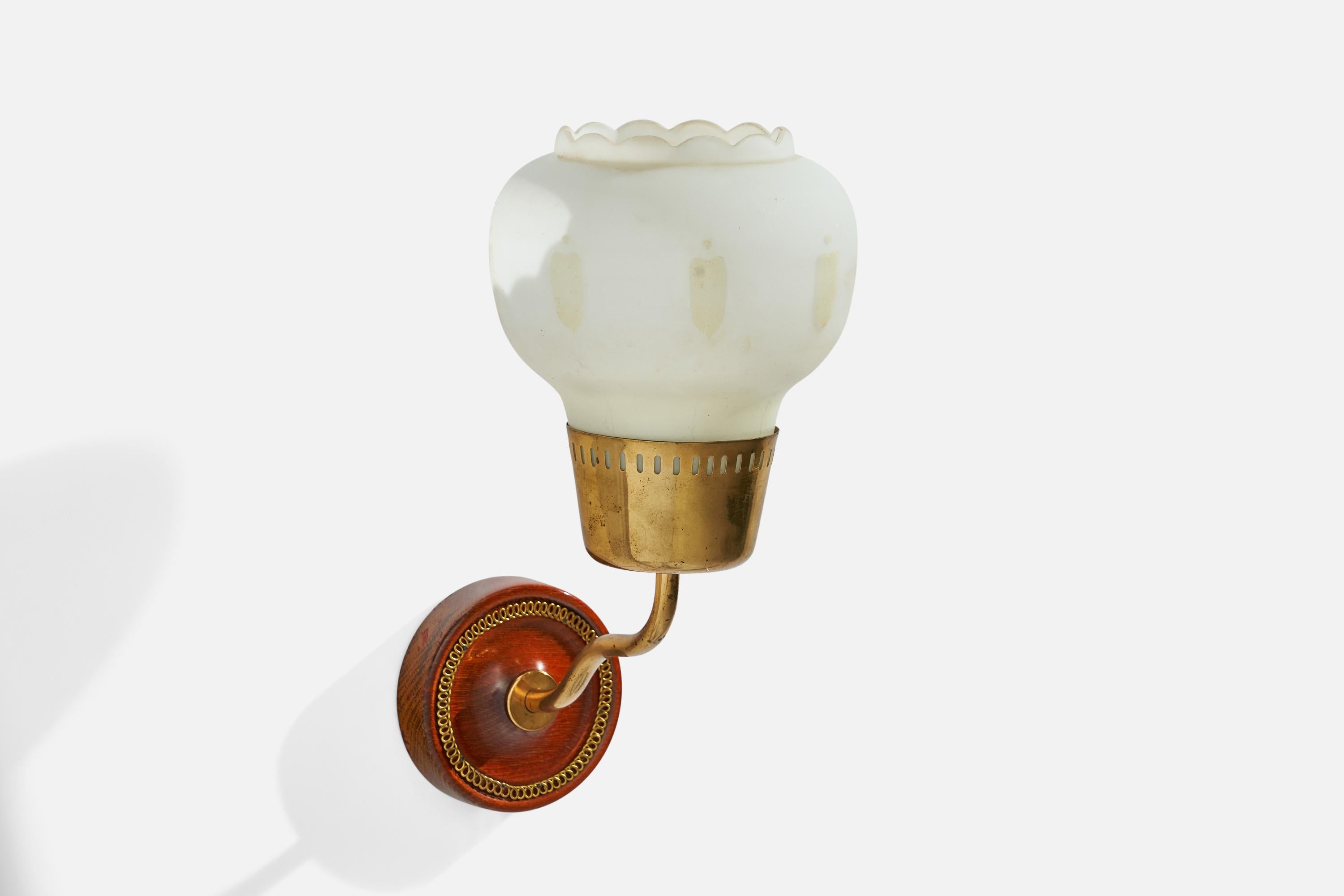 A brass, mahogany and opaline glass wall light designed and produced in Sweden, 1940s.

Overall Dimensions (inches): 10.5” H x 5.5”  W x 8.5” D
Back Plate Dimensions (inches): 3.75”  H x 3.75”  W x .75” D
Bulb Specifications: E-26 Bulb
Number of