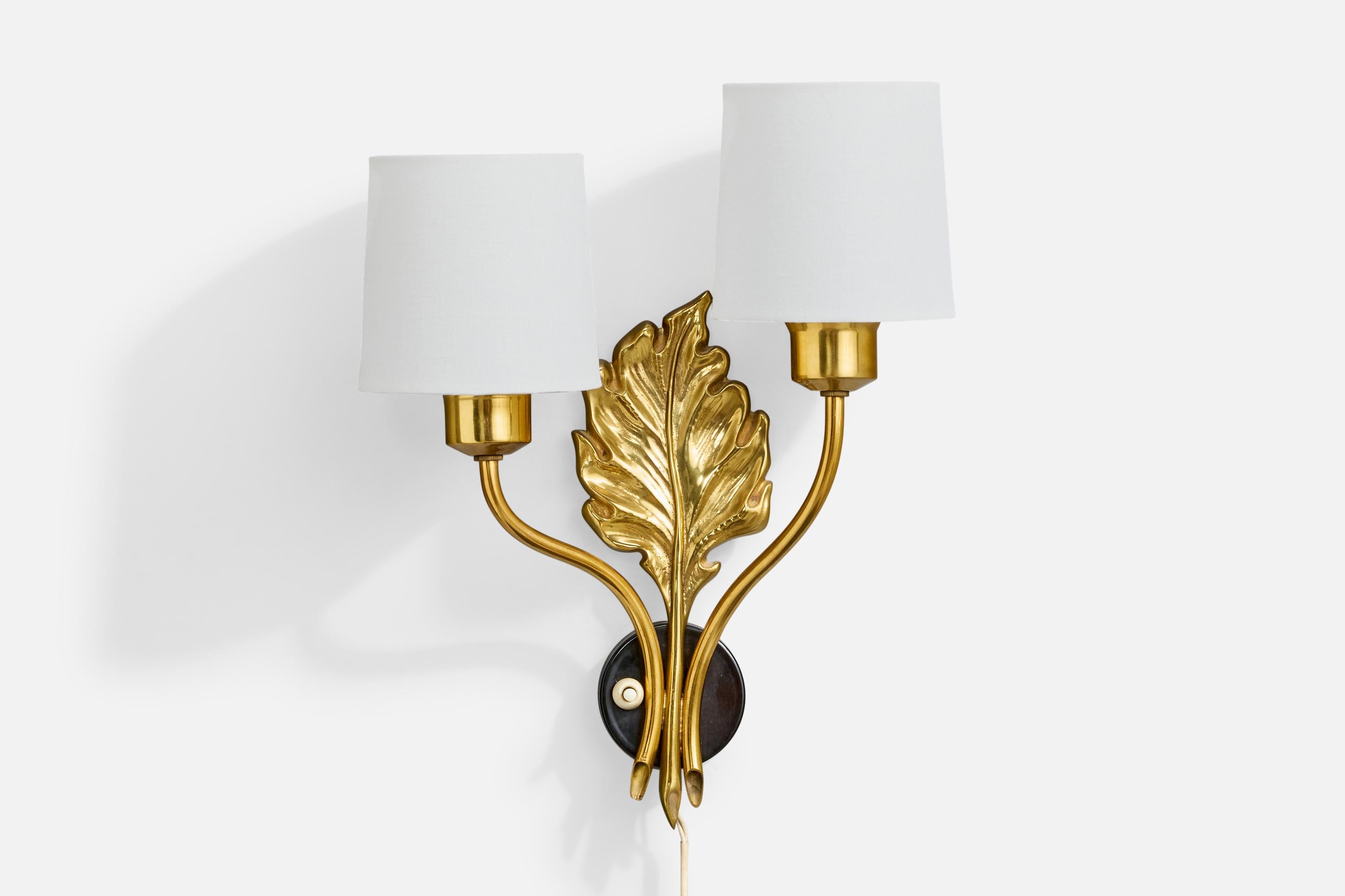 A brass, black-lacquered metal and white fabric wall light designed and produced in Sweden, c. 1950s.

Oxidation present to brass

Wear consistent with age and use

Overall Dimensions (inches): 14.25