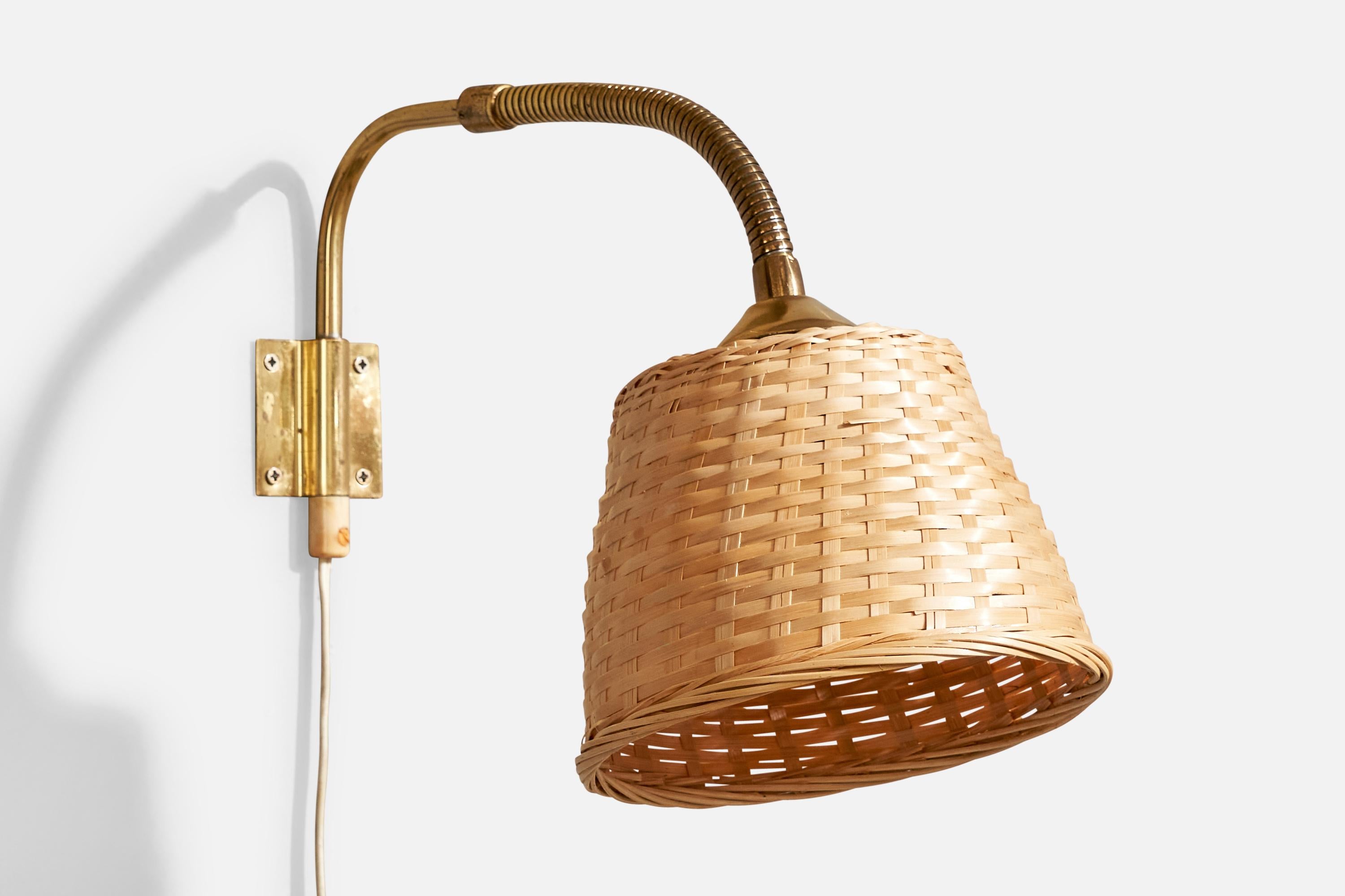 An adjustable brass and rattan wall light designed and produced in Sweden, c. 1940s.

Overall Dimensions (Inches): 9.375” H x 7” W x 13” D

Back Plate Dimensions (Inches): 2.3” H x 2.3” W x .125” D

Bulb Specifications: E-26

Number of Sockets (per