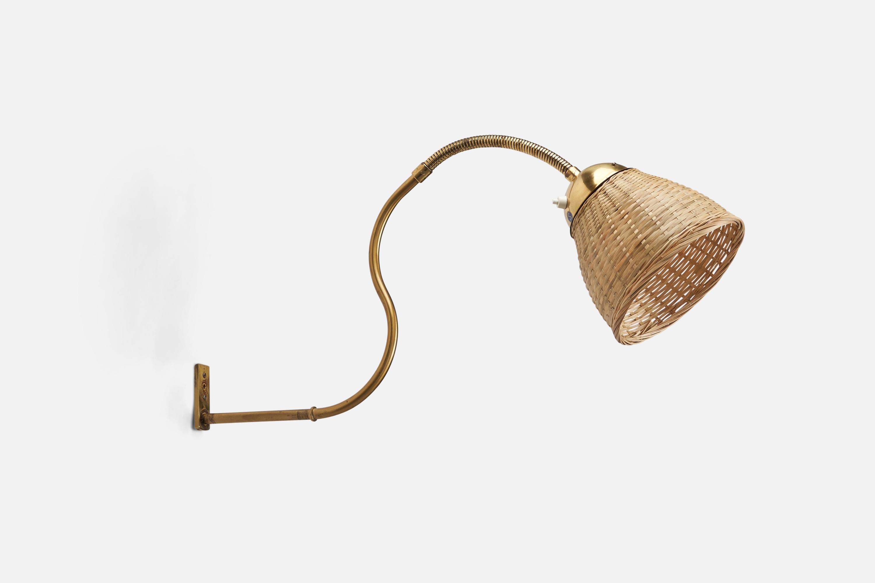 A brass and rattan wall light designed and produced by a Swedish Designer, Sweden, 1940s.

Dimensions of Back Plate (inches) : 2.9 x 1 x 0.2 (Height x Width x Depth)

Socket takes standard E-26 medium base bulb.

There is no maximum wattage