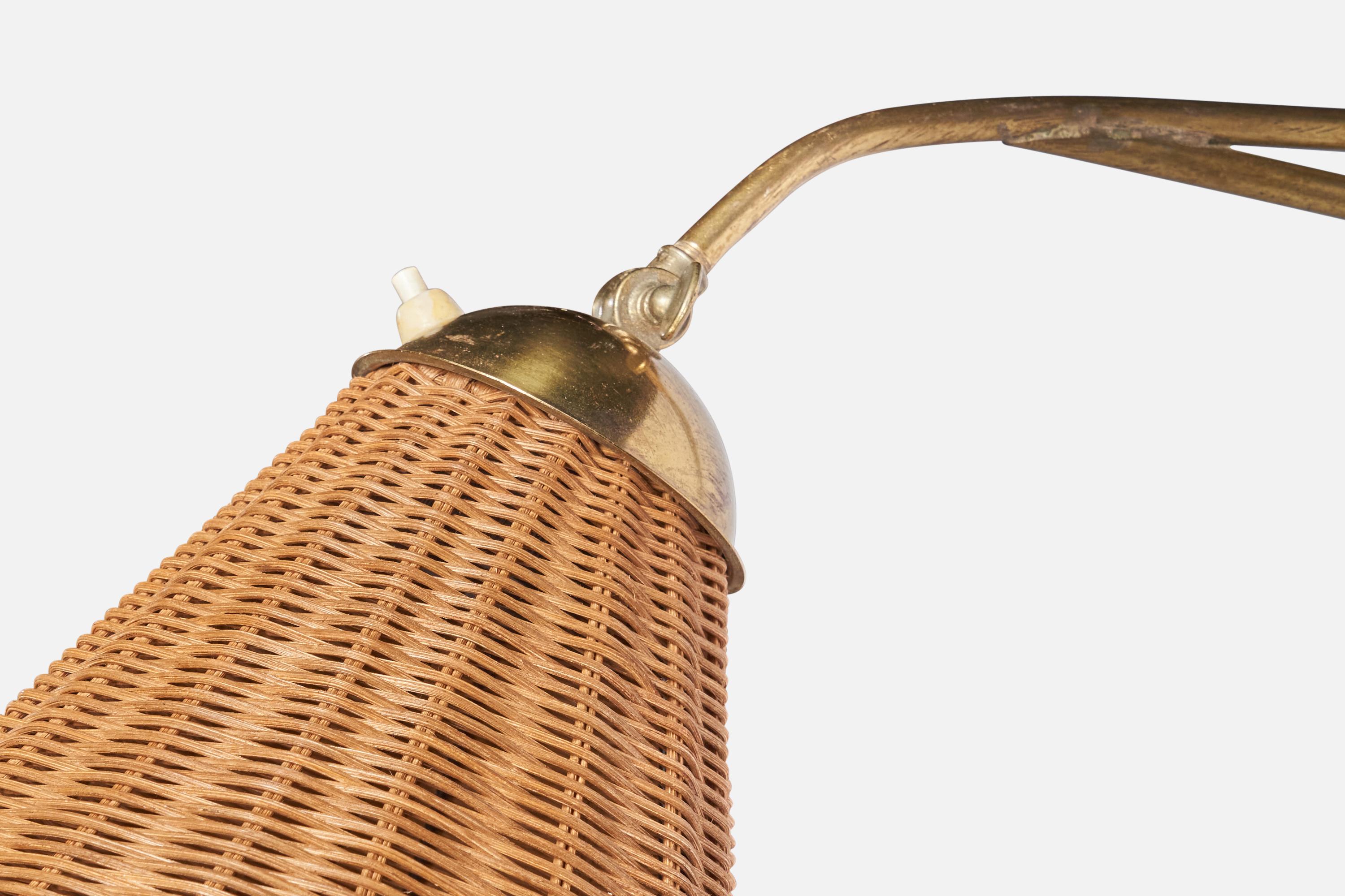 
An adjustable brass and rattan wall light designed and produced in Sweden, 1940s.
Overall Dimensions (inches): 11.65” H x 9.1” W x 35.5” D
Back Plate Dimensions (inches): 6.5” H, 1.2” W, 1.25 D
Bulb Specifications: E-26 Bulb
Number of Sockets: