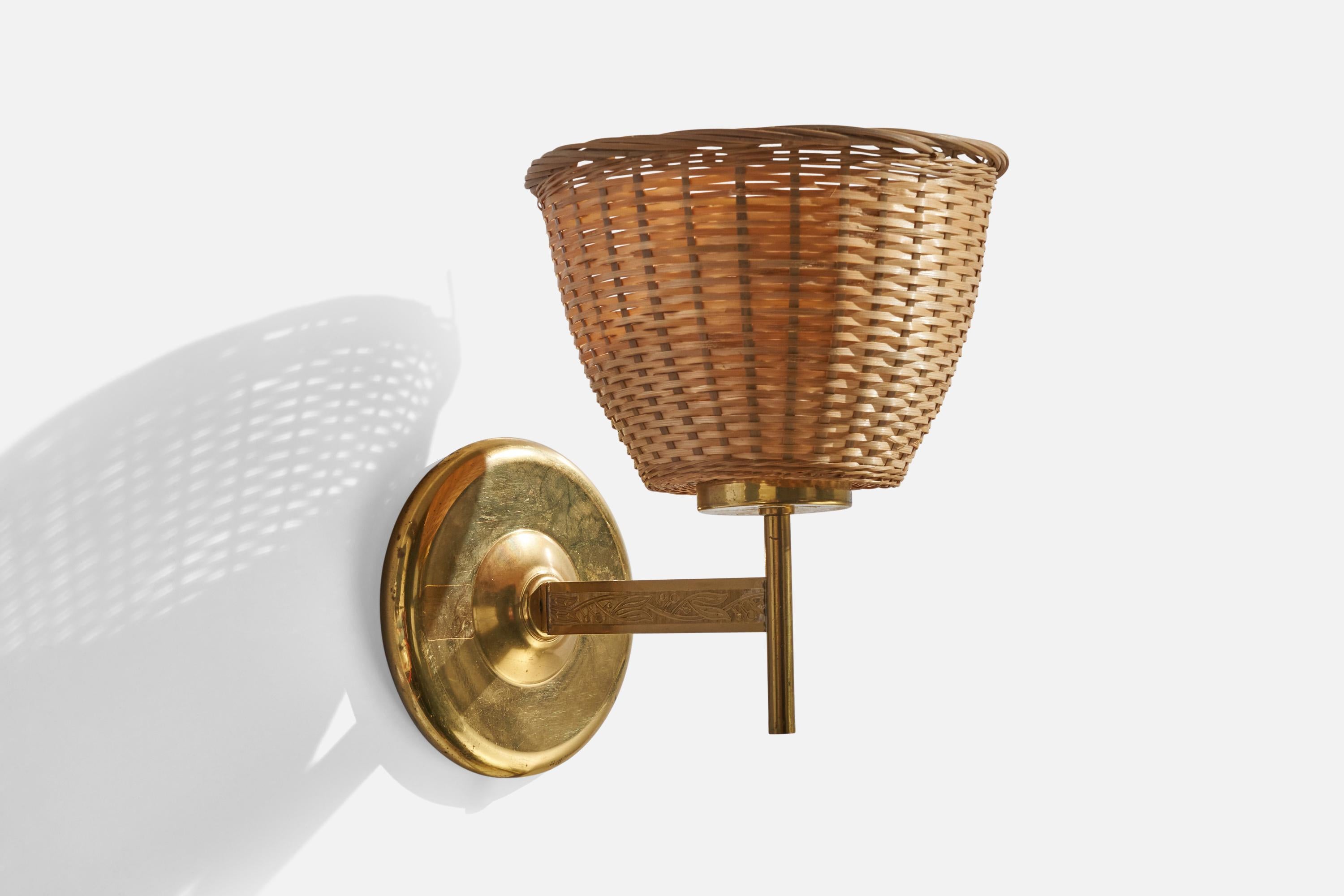 A brass and rattan wall light designed and produced in Sweden, 1960s.

Overall Dimensions (inches): 9” H x 6.75”  W x 9” D
Back Plate Dimensions (inches): 5”  H x 5” W x .75” D
Bulb Specifications: E-26 Bulb
Number of Sockets: 1
All lighting will be