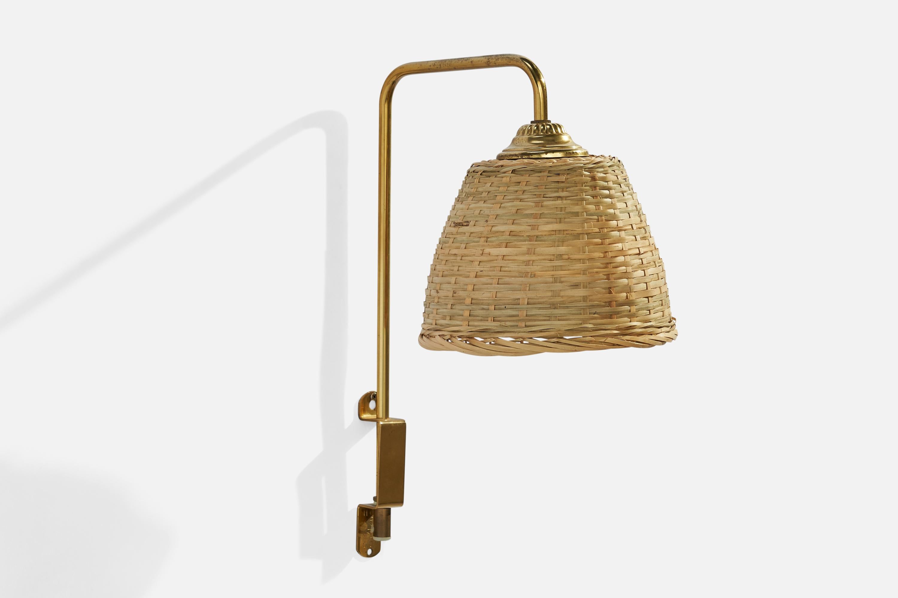 A brass and rattan wall light designed and produced in Sweden, 1960s.

Overall Dimensions (inches): 14.5”  H x 7.0” W x 10.50” D
Back Plate Dimensions (inches): 5” H x 1” W x .25”  D
Bulb Specifications: E-26 Bulb
Number of Sockets: 1
All lighting