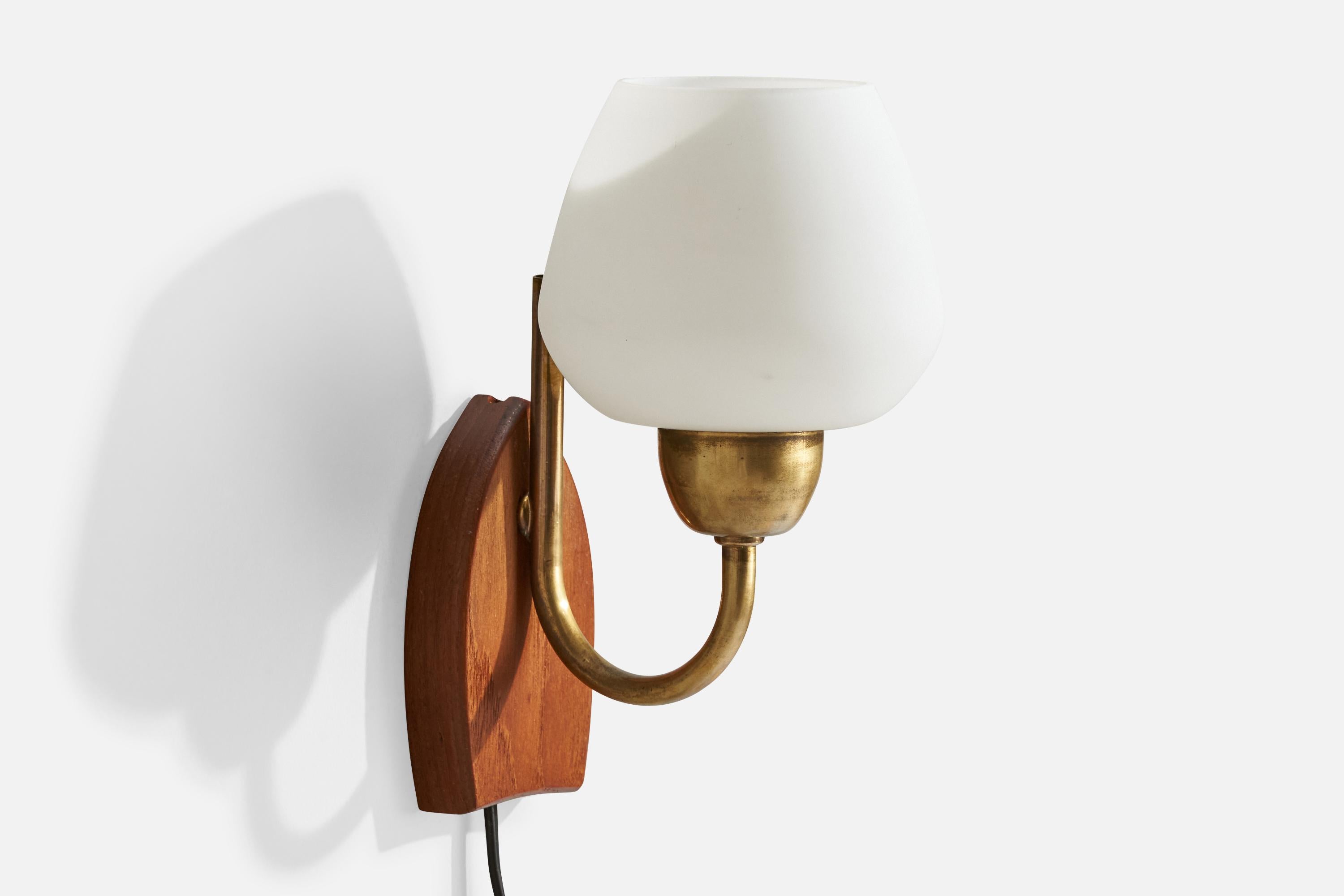 A brass, teak and white opaline glass wall light designed and produced in Sweden, c. 1950s.

Overall Dimensions (inches):  8.125” H x 5” W x 6“ D

Back Plate Dimensions (Inches): 4.75