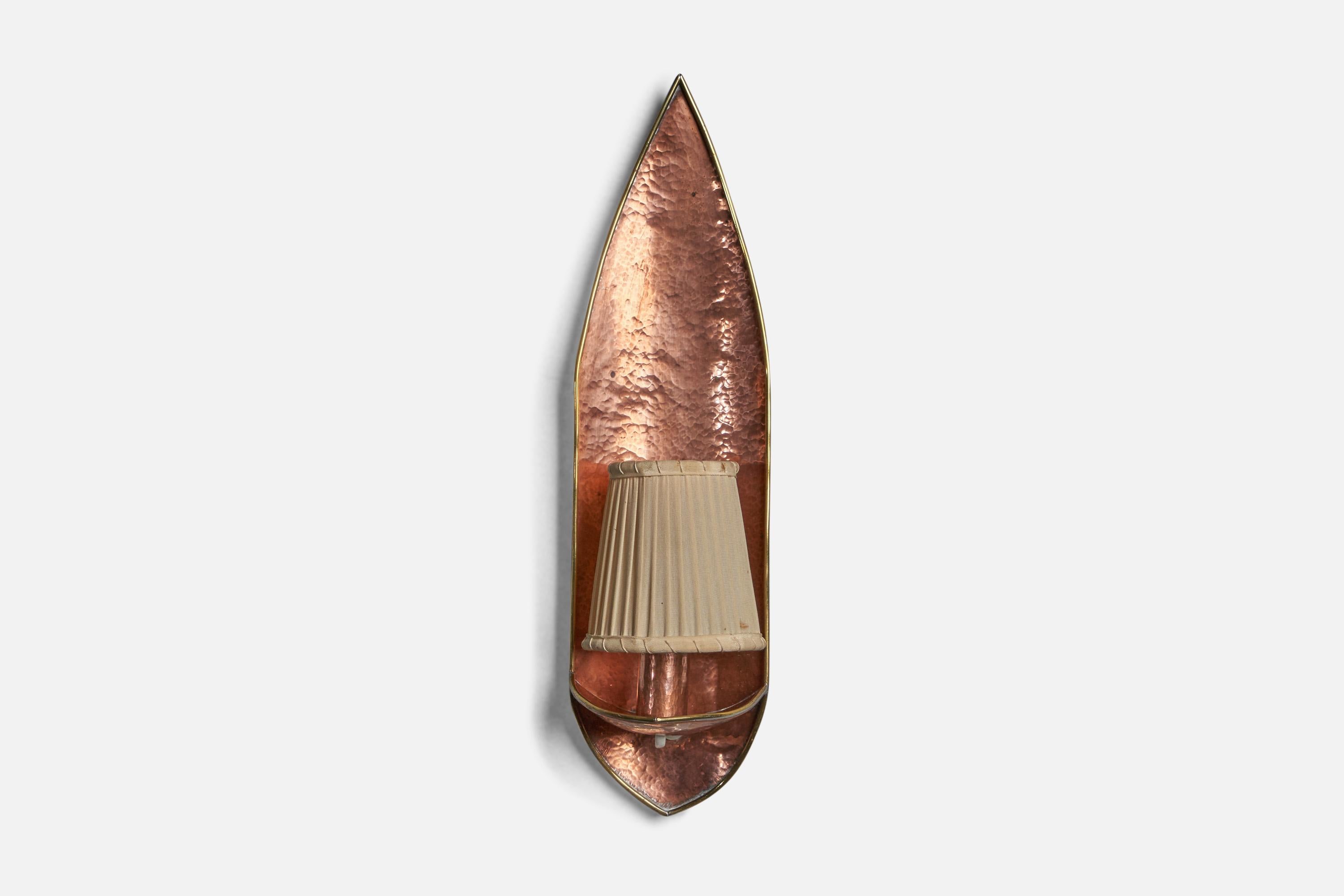 A hammered copper and beige fabric wall light designed and produced in Sweden, c. 1950s.

Overall Dimensions (inches): 15” H x 4” W x 4.25” D
Bulb Specifications: E-14 Bulb
Number of Sockets: 1