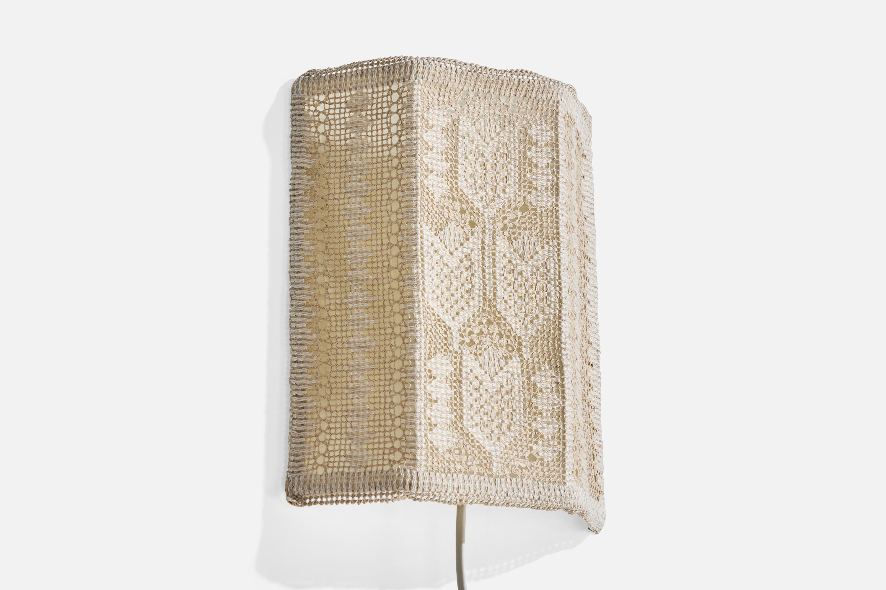 An off-white embroidery fabric and metal wall light designed and produced in Sweden, c. 1960s.

Overall Dimensions (Inches): 10.5