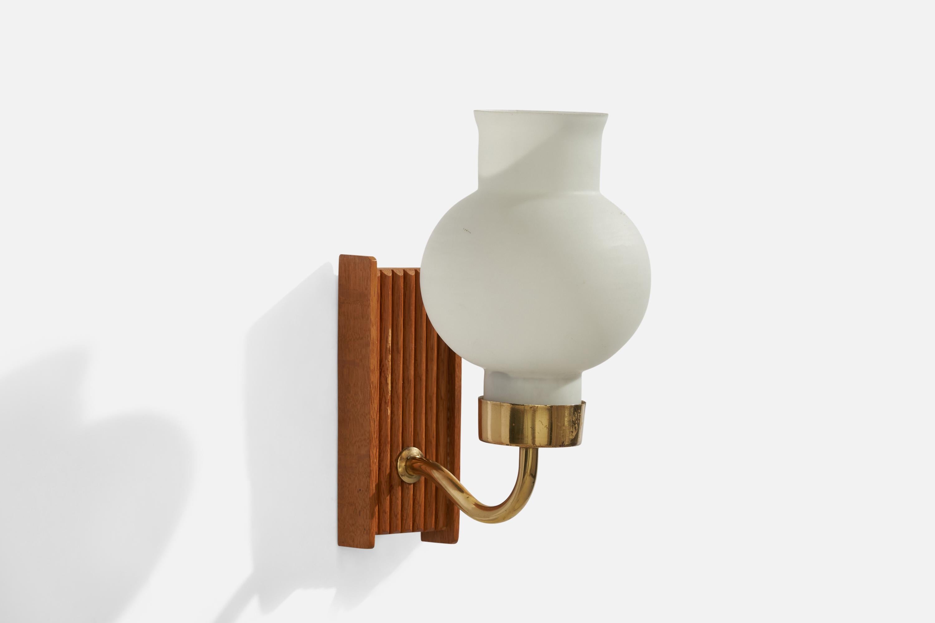 An oak, brass and opaline glass wall light designed and produced in Sweden, 1950s.

Overall Dimensions (inches): 8.75”  H x 4” W x 6.75” D
Back Plate Dimensions (inches): 5.75” H x 2.25” W x 1” D
Bulb Specifications: E-14 Bulb
Number of Sockets: