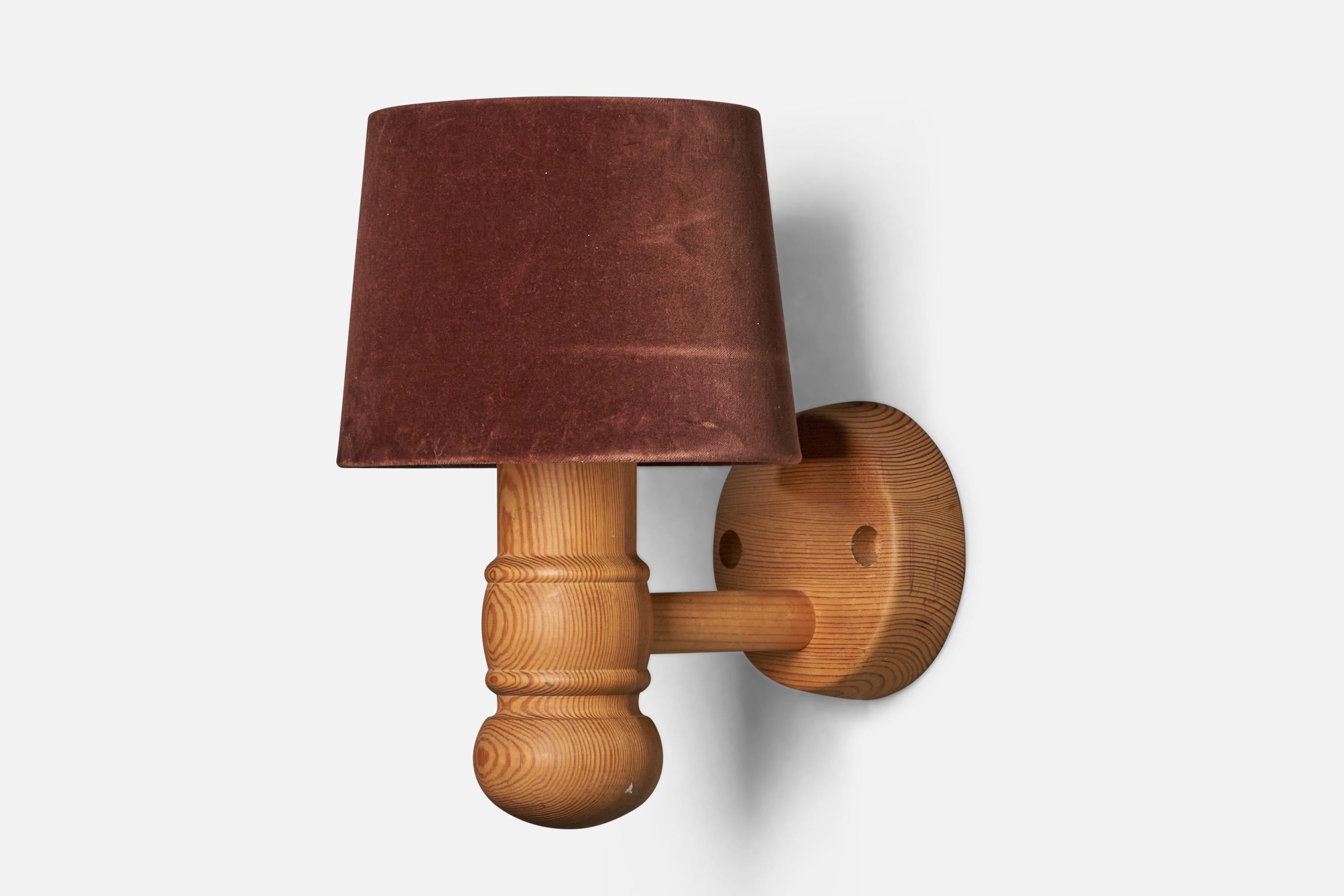 A pine and brown velvet wall light designed and produced in Sweden, 1970s.

Overall Dimensions (inches): 15” H x 9” W x 12” D
Bulb Specifications: E-26 Bulb
Number of Sockets: 1