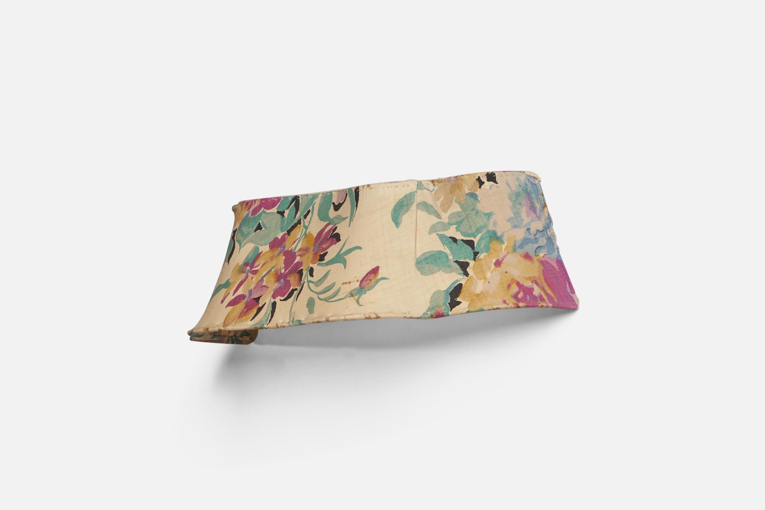 A printed floral fabric wall light, designed and produced in Sweden, c. 1940s.
Overall Dimensions (inches): 13.25