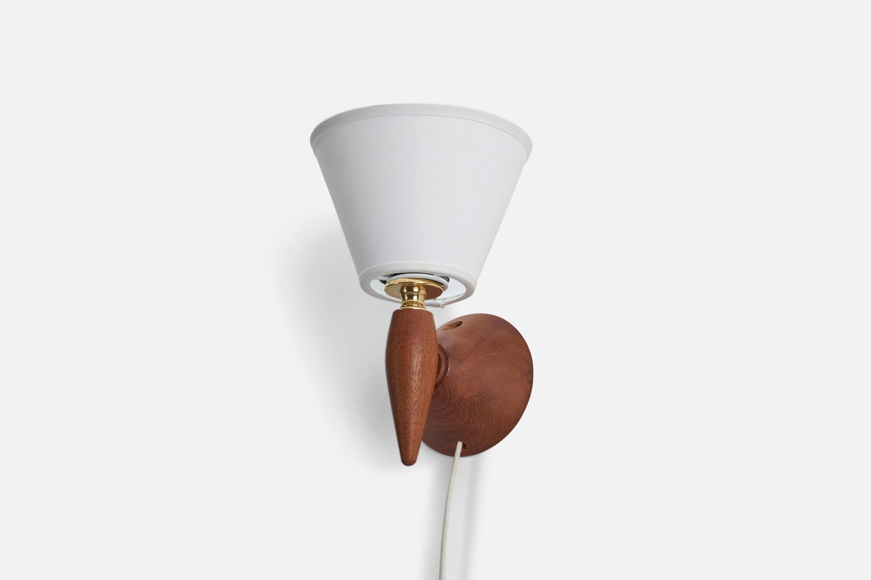 A teak, brass and fabric wall light / sconce designed and produced by a Swedish designer, Sweden, 1950s.

Dimensions stated are of Sconce with Lampshade.

Dimensions of Back Plate (inches) : 3.75 x 3.75 x 1.08 (height x width x depth).

Socket
