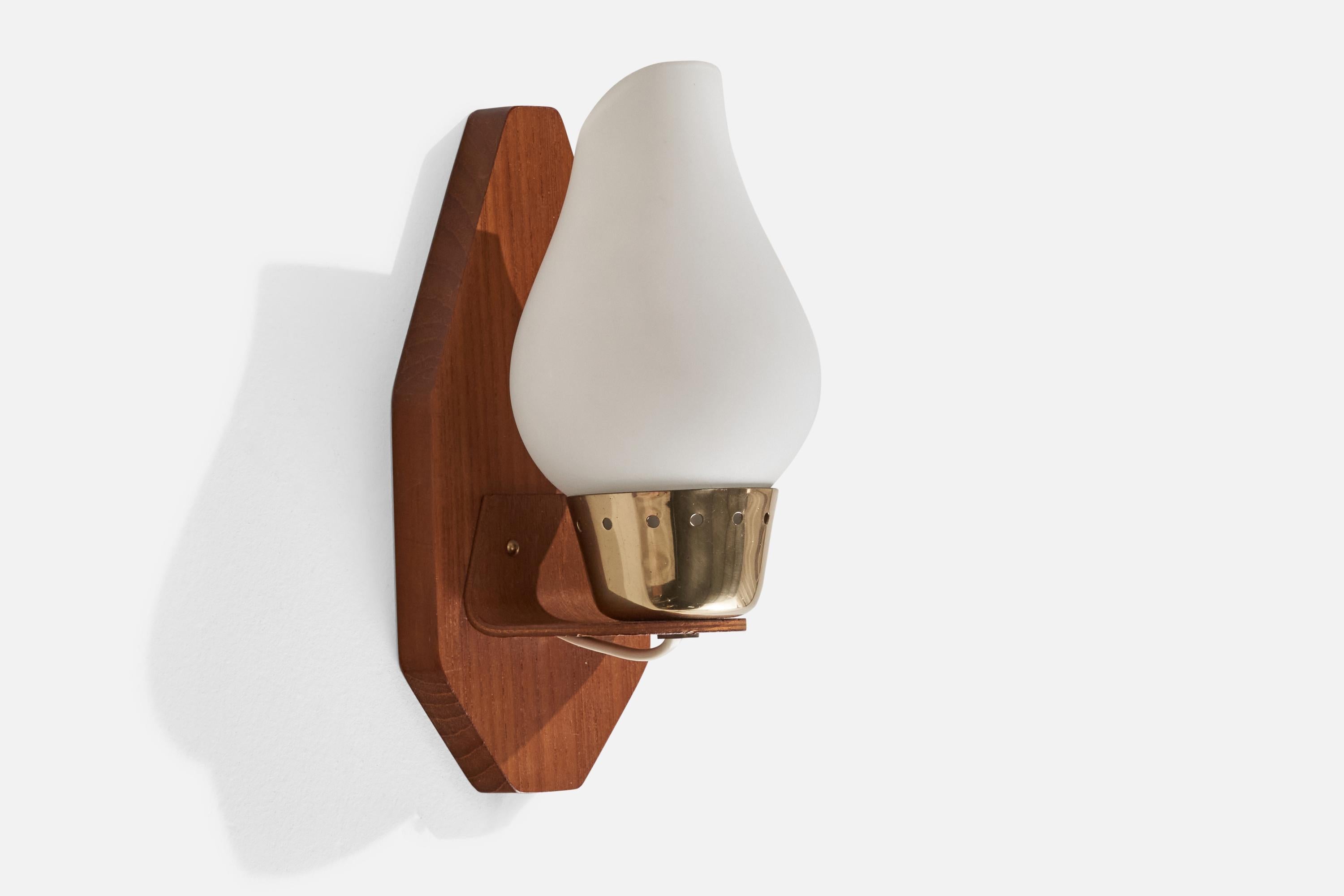 A teak, brass and opaline glass wall light designed and produced in Sweden, c. 1950s.

Overall Dimensions (inches): 8.25” H x 3.64” W x 4.25” D
Back Plate Dimensions (inches): 7.75” H x 3.64” W x 0.80” D
Bulb Specifications: E-14 Bulb
Number of