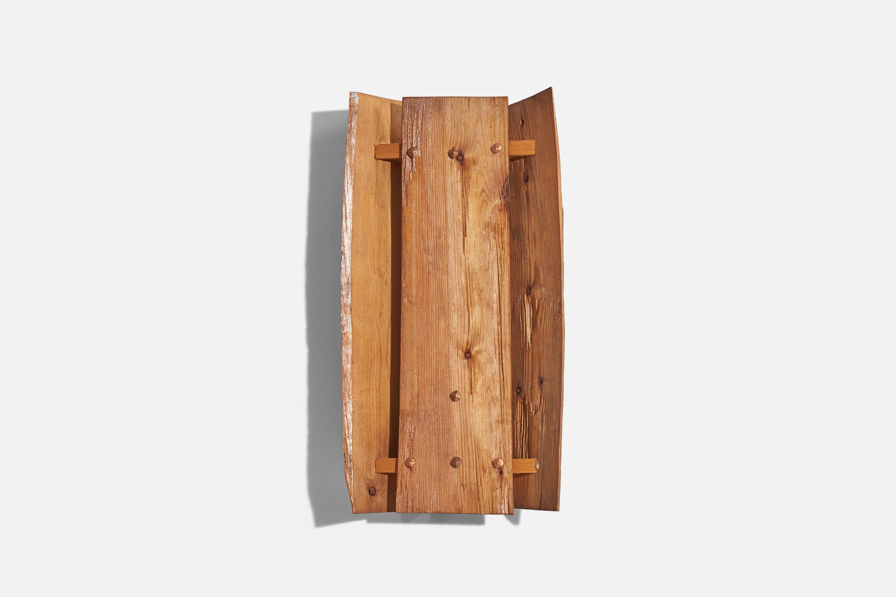 A wooden wall light designed and produced in Sweden, 1970s.