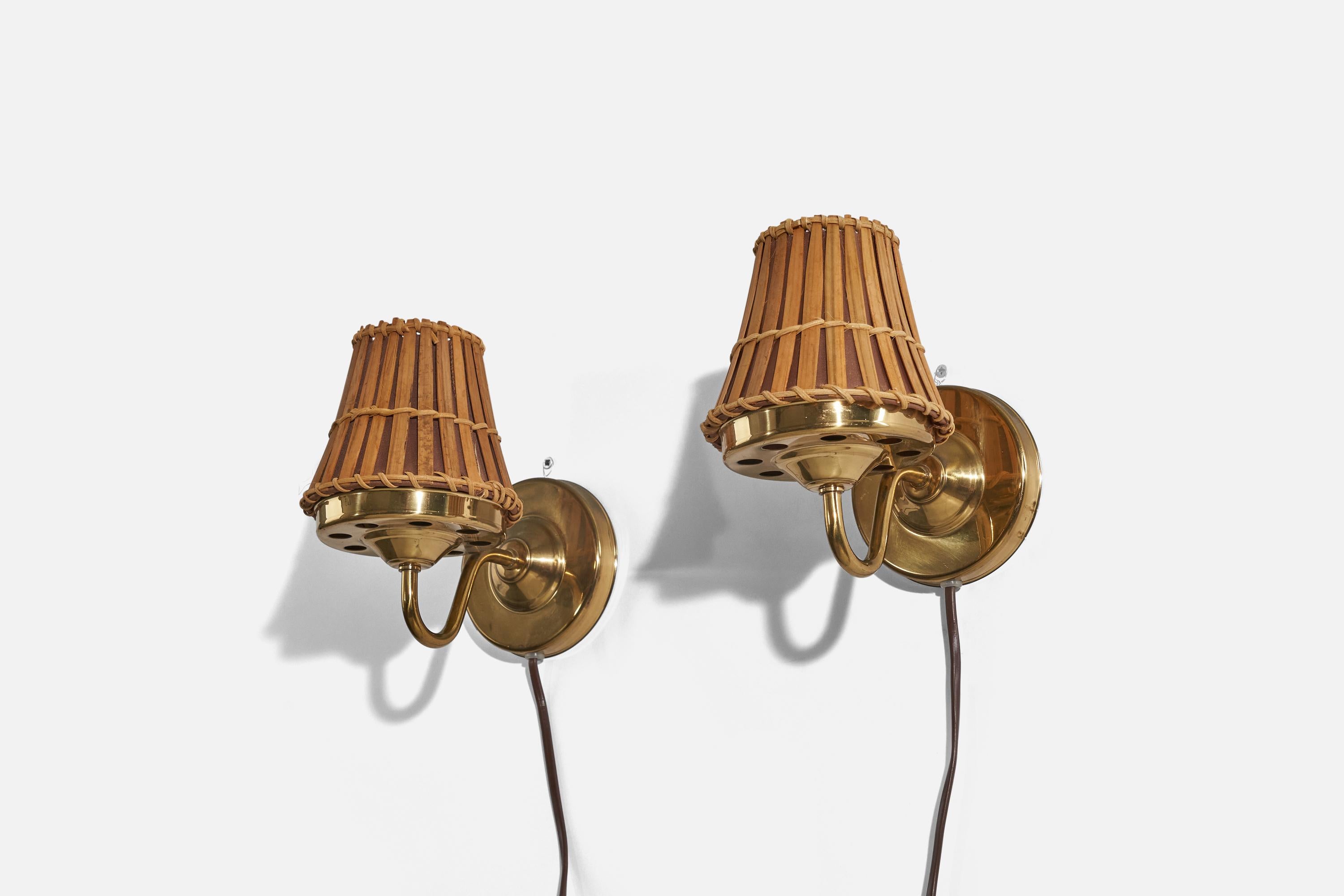 A pair of bamboo and brass wall lights designed in Sweden, c. 1970s. 

Dimensions of back plate (inches) : 4.37 x 4.37 x 0.62 (H x W x D).
Lampshades can be purchased with the lamps.