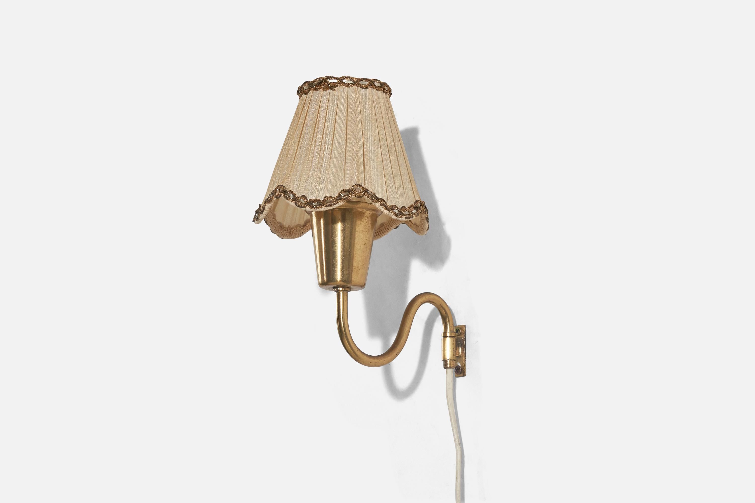 A pair of brass and fabric wall lights designed and produced in Sweden, c. 1940s.

Sold with Lampshade. 
Stated dimensions refer to the Sconce with the Shade.
 