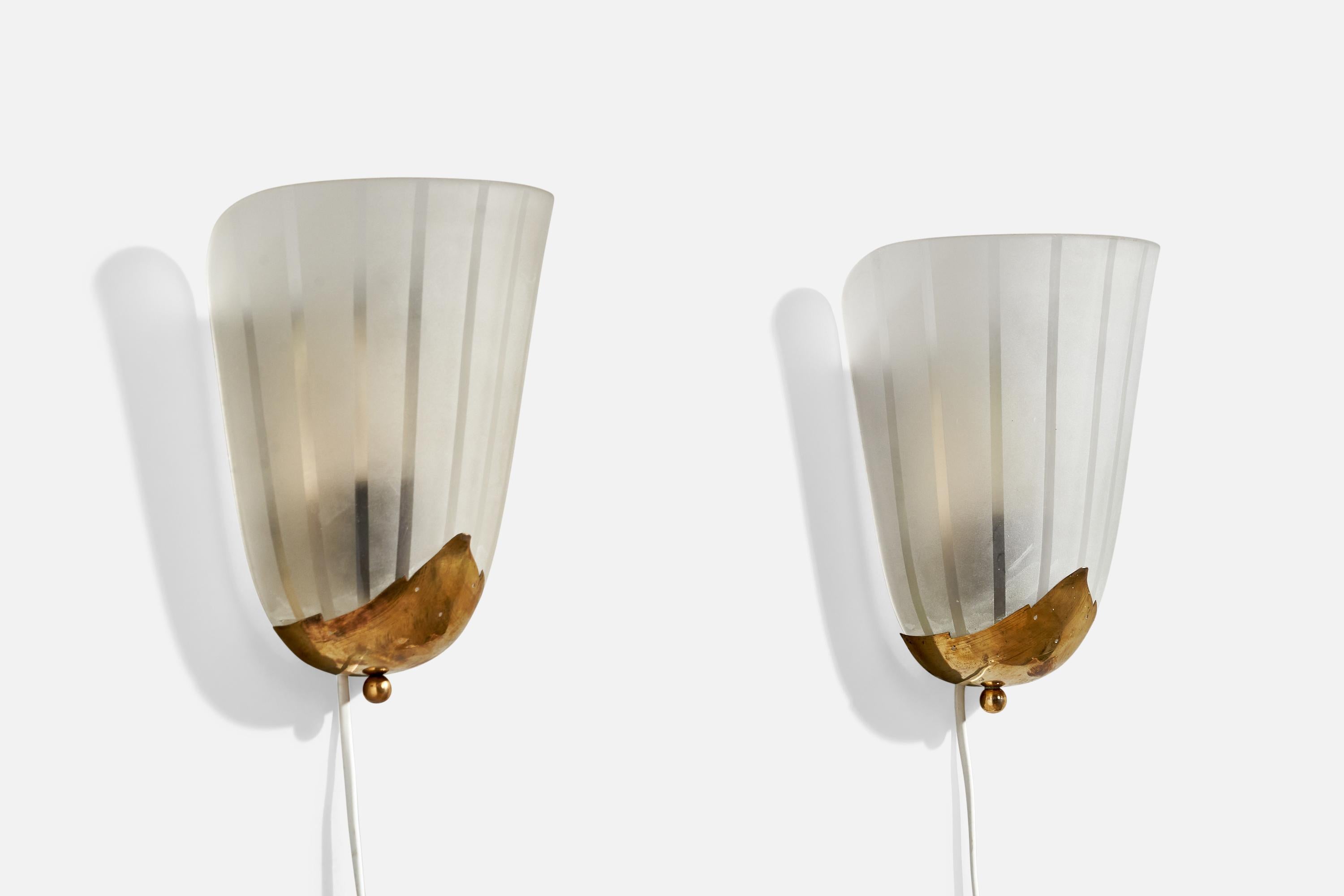 A pair of brass and etched glass wall lights designed and produced in Sweden, c. 1940s.

Overall Dimensions (inches):  9.75” H x  7.25” W x  4.5“ D

Back Plate Dimensions (Inches):  6.5” H x 2.75” W x .5” D

Bulb Specifications: E-26

Number of