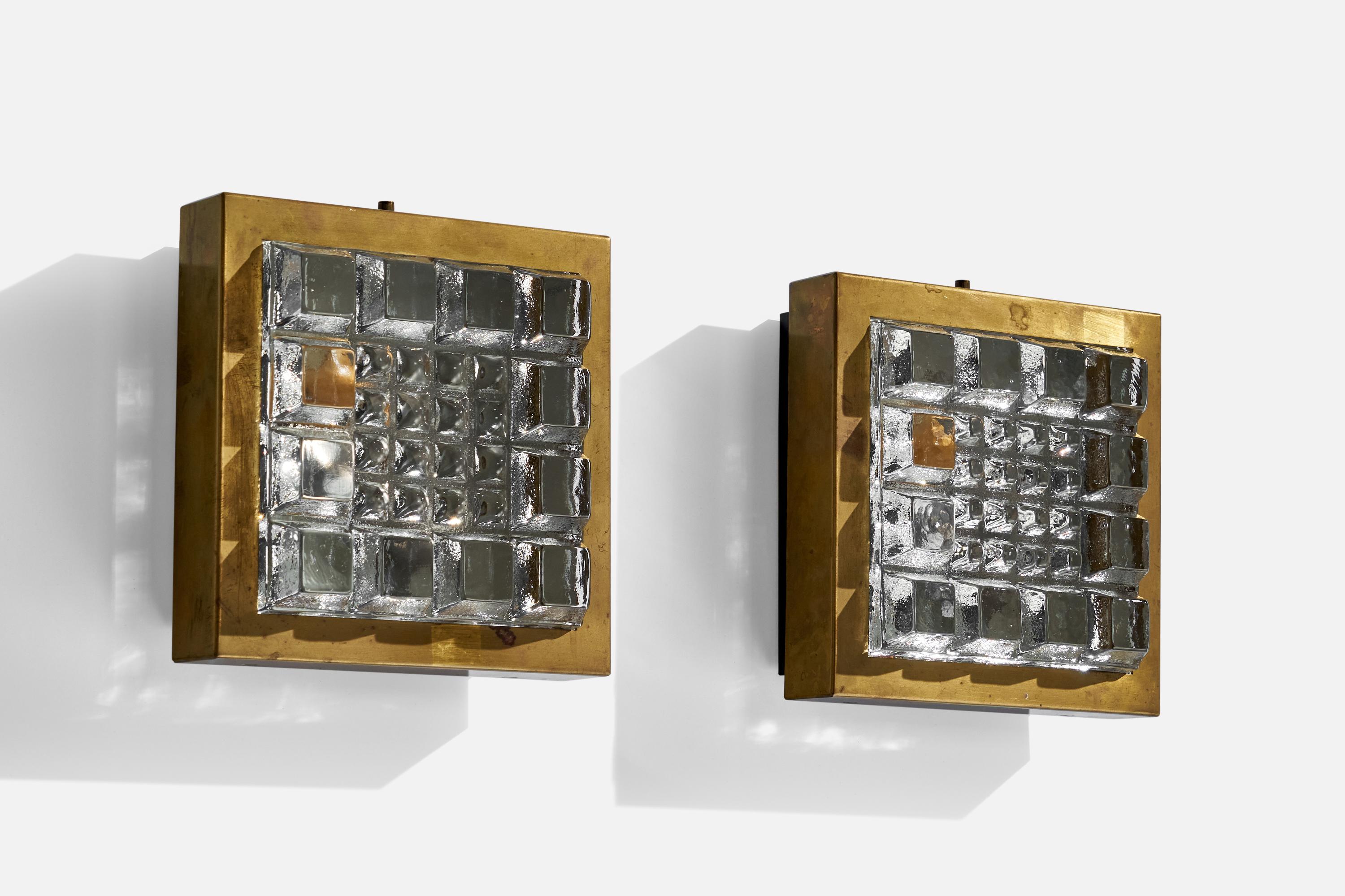 A pair of brass and glass wall lights or flush mounts designed and produced in Sweden, 1960s.

Overall Dimensions (inches): 7.50” H x 7.25” W x 3.50” D
Back Plate Dimensions (inches): N/A
Bulb Specifications: E-14 Bulb
Number of Sockets: 2
All