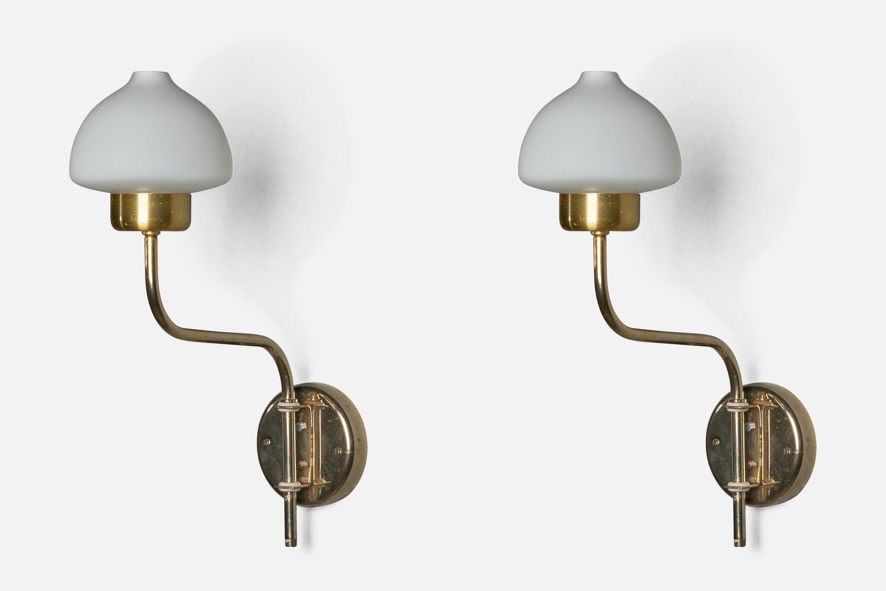 A pair of adjustable brass and opaline glass wall lights designed and produced in Sweden, 1970s.

Please note cord feeds from bottom of stem via plug-in, not convertible to hard wire.

Overall Dimensions (inches): 15” H x 4.75” W x 10.5” D
Bulb