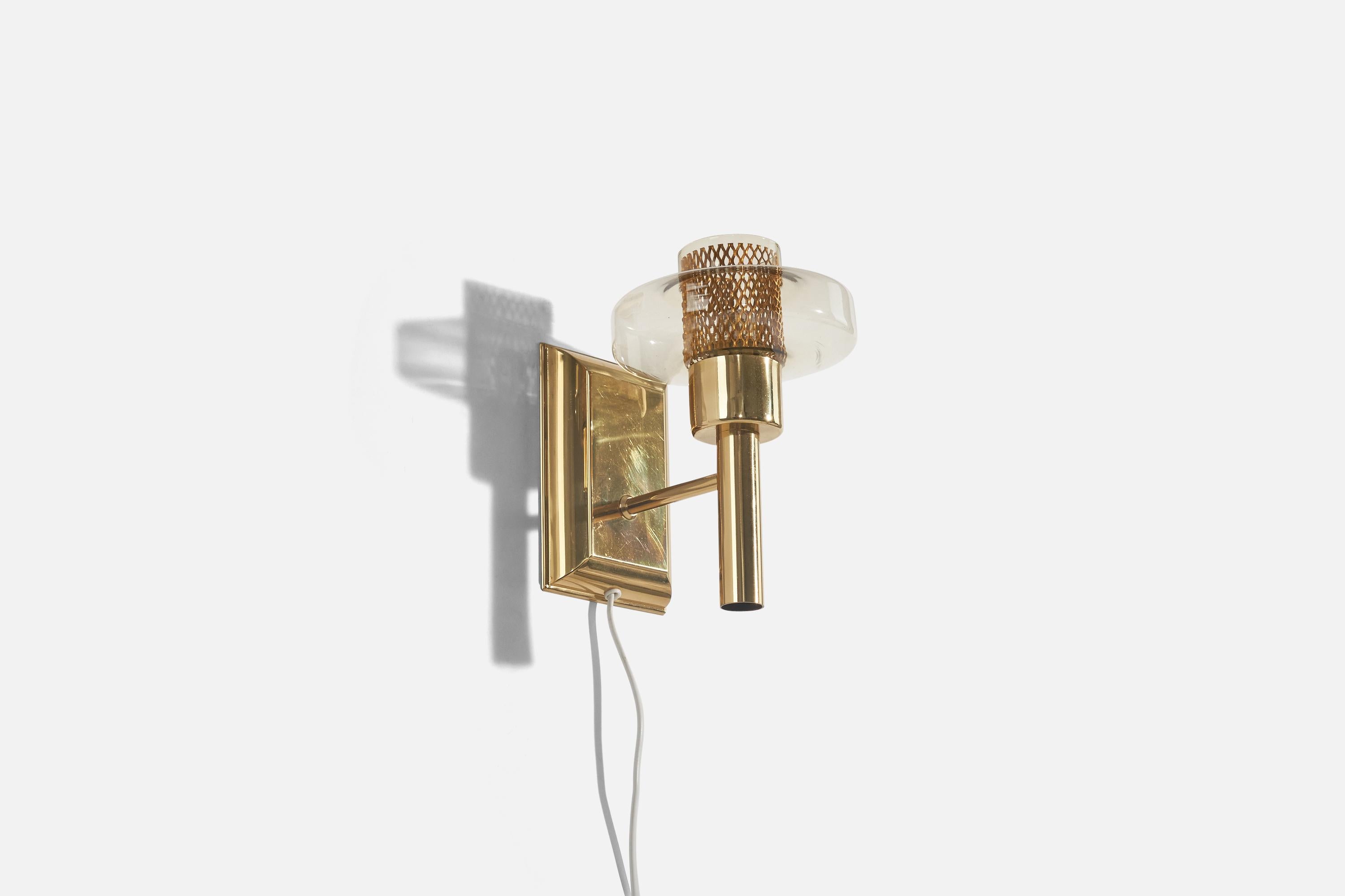 A pair of brass and glass wall lights designed and produced in Sweden, c. 1970s. 

Dimensions of back plate (inches) : (5.93 x 4 x .87).