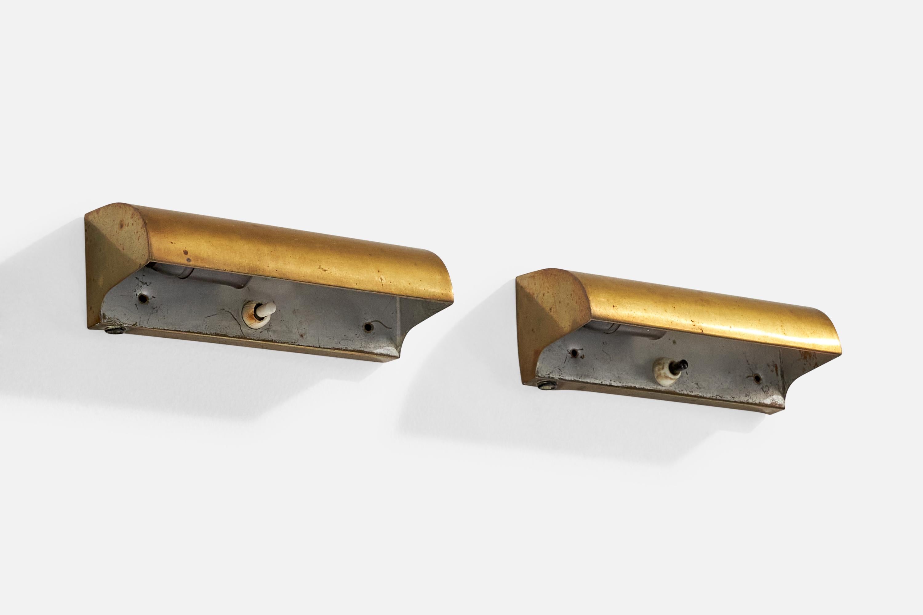 A pair of brass and metal wall lights designed and produced in Sweden, c. 1940s.

Overall Dimensions (Inches): 7.125” H x 2.4” W x 2.5“ D

Back Plate Dimensions (Inches): 7.125” H x 2.4“ W 

Bulb Specifications: E-14

Number of Sockets (per