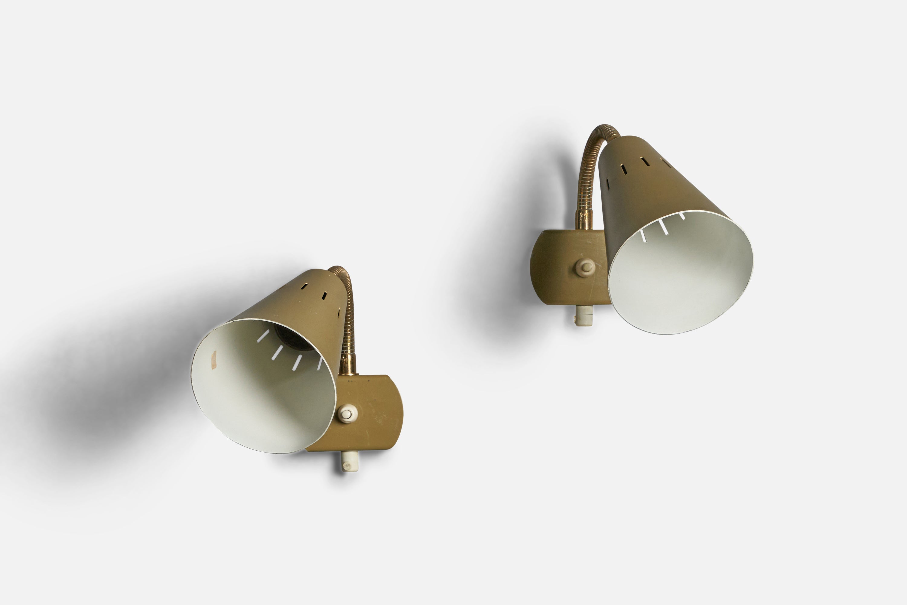 A pair of adjustable brass and beige white lacquered metal wall lights, designed and produced in Sweden, c. 1960s.

Overall Dimensions (inches): 8” H x 4” W x 9” D
Back Plate Dimensions (inches): 2.25” H x 3.5” W x 0.75” D
Bulb Specifications: E-26