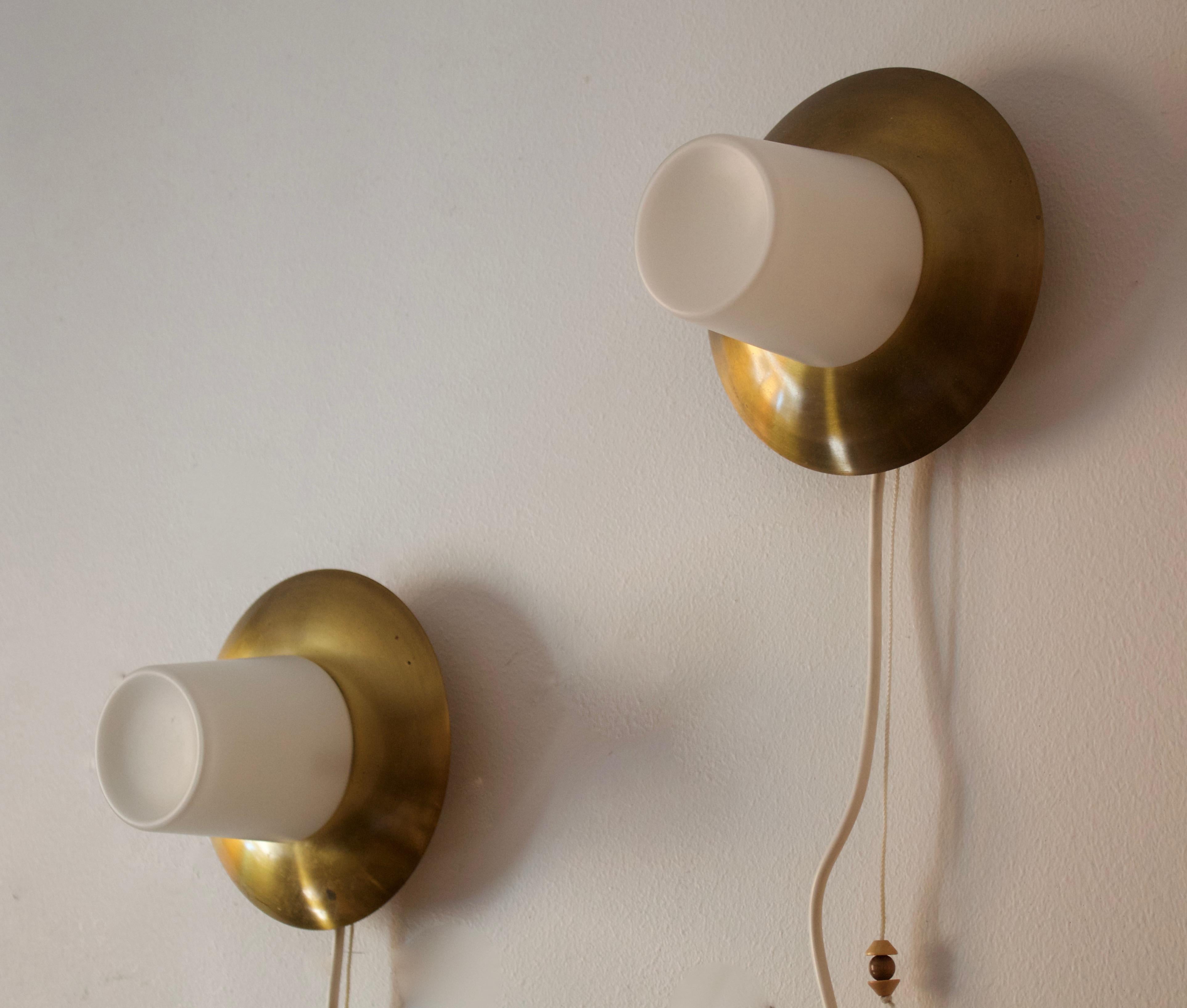 A pair of wall lights, designed and produced in Sweden, c. 1950s-1960s.