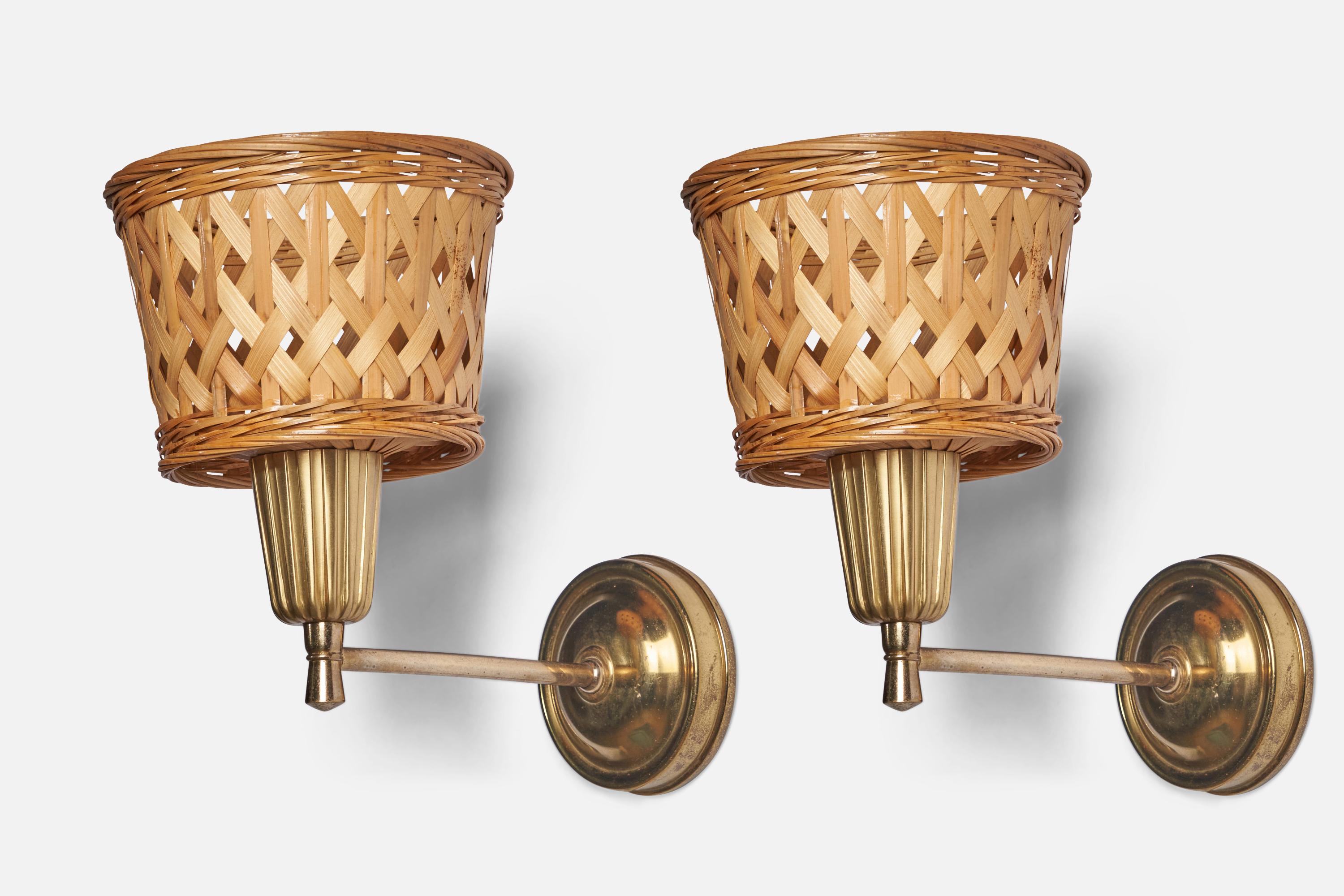 A pair of brass and rattan wall lights designed and produced in Sweden, c. 1970s.

Overall Dimensions: 9.5