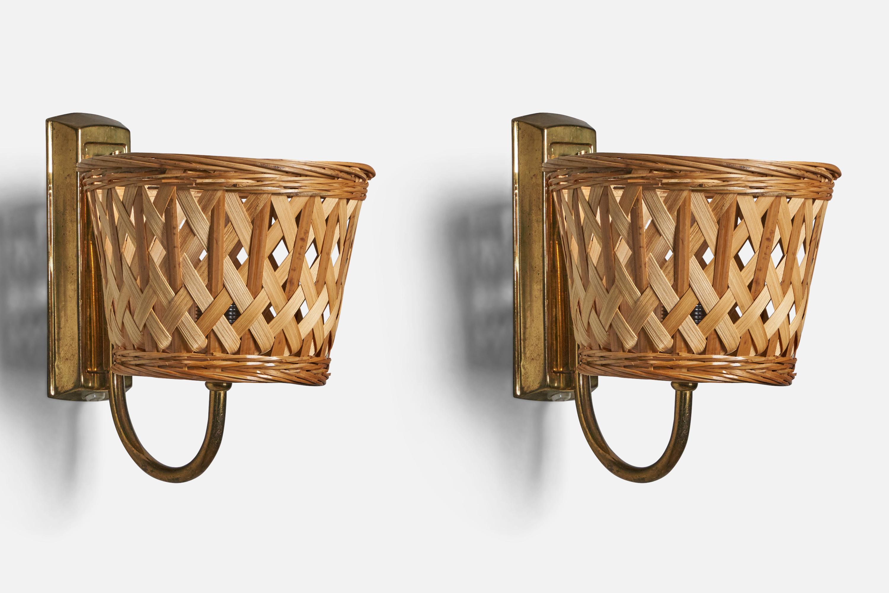 A pair of brass and rattan wall lights, designed and produced in Sweden, c. 1970s.

Overall Dimensions (inches):7.8