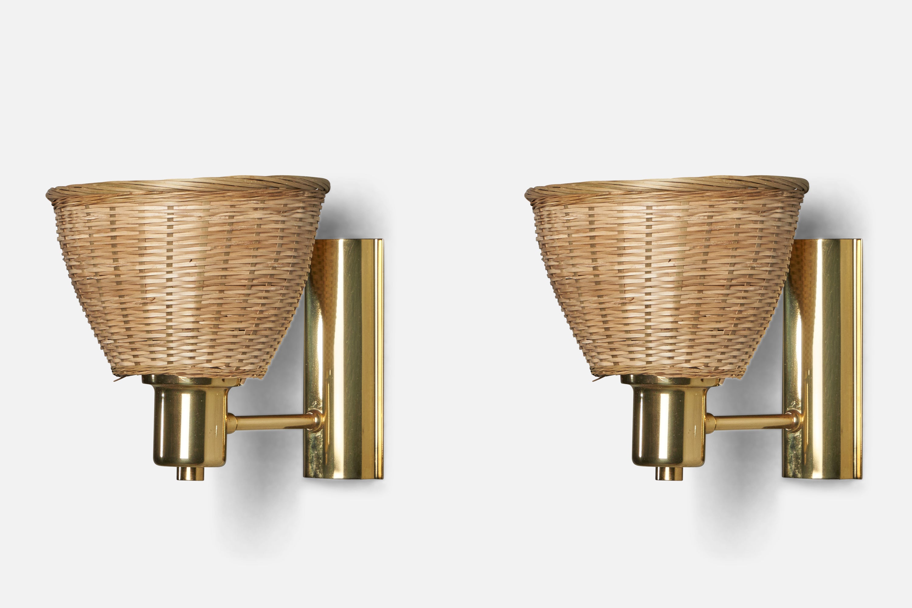A pair of brass and rattan wall lights designed and produced in Sweden, c. 1970s.

Overall Dimensions (inches): 7” H x 6.75” W x 8” D
Back Plate Dimensions (inches): 5.9” H x 2.75” W x 1.15” D
Bulb Specifications: E-26 Bulb
Number of Sockets: 1