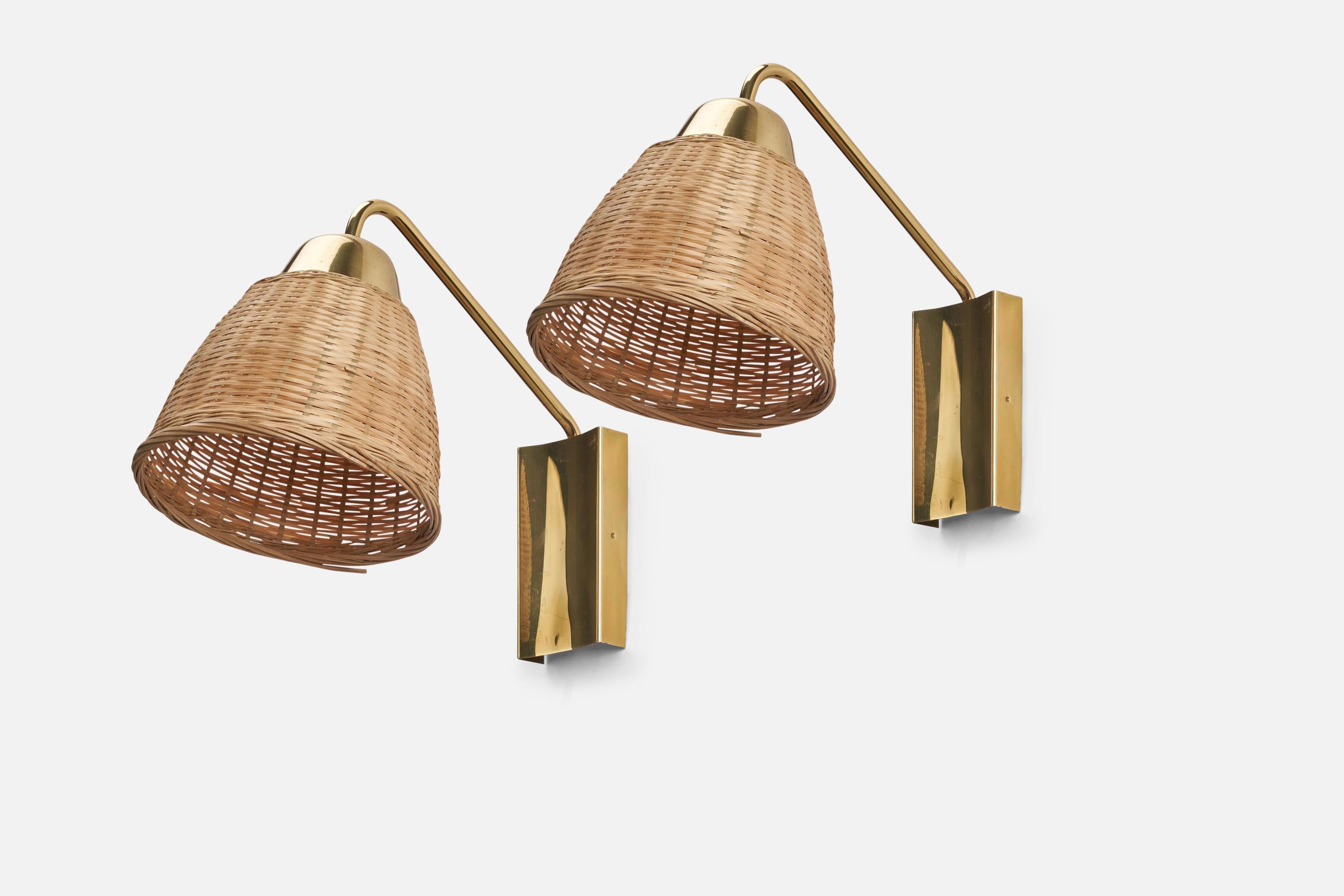 A pair of brass and rattan wall lights designed and produced by a Swedish Designer, Sweden, circa 1970s.

Dimensions stated are of Sconces with Lampshades.

Dimensions of Back Plate (inches) : 4.9 x 2.7 x 0.87 (Height x Width x Depth)

Sockets