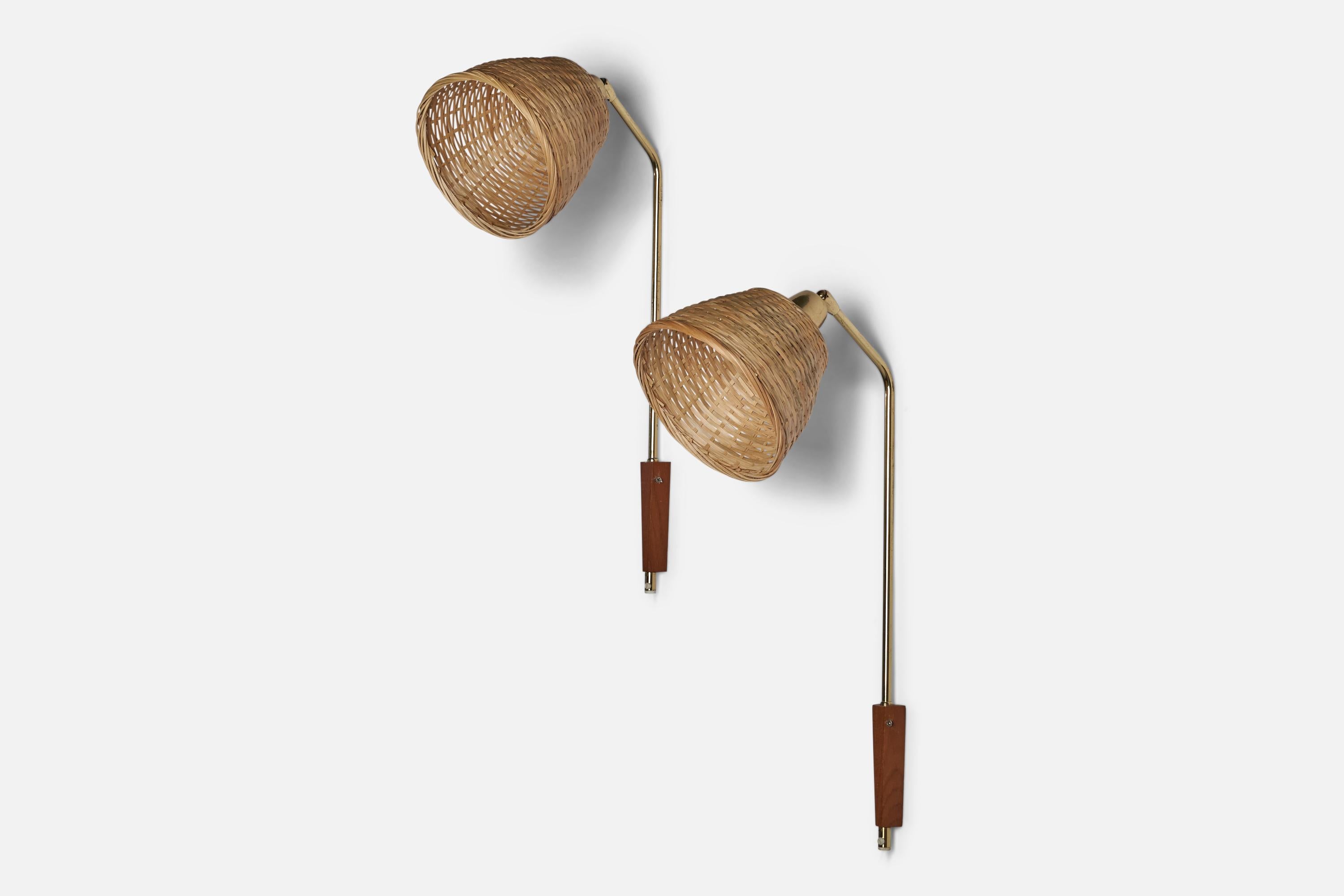 A pair of brass, rattan and teak wall lights designed and produced in Sweden, c. 1960s.

Overall Dimensions (inches): 26” H x 7” W x 11.5” D
Back Plate Dimensions (inches): 4.5” H x 1.25” W x 0.8” D
Bulb Specifications: E-26 Bulb
Number of Sockets: