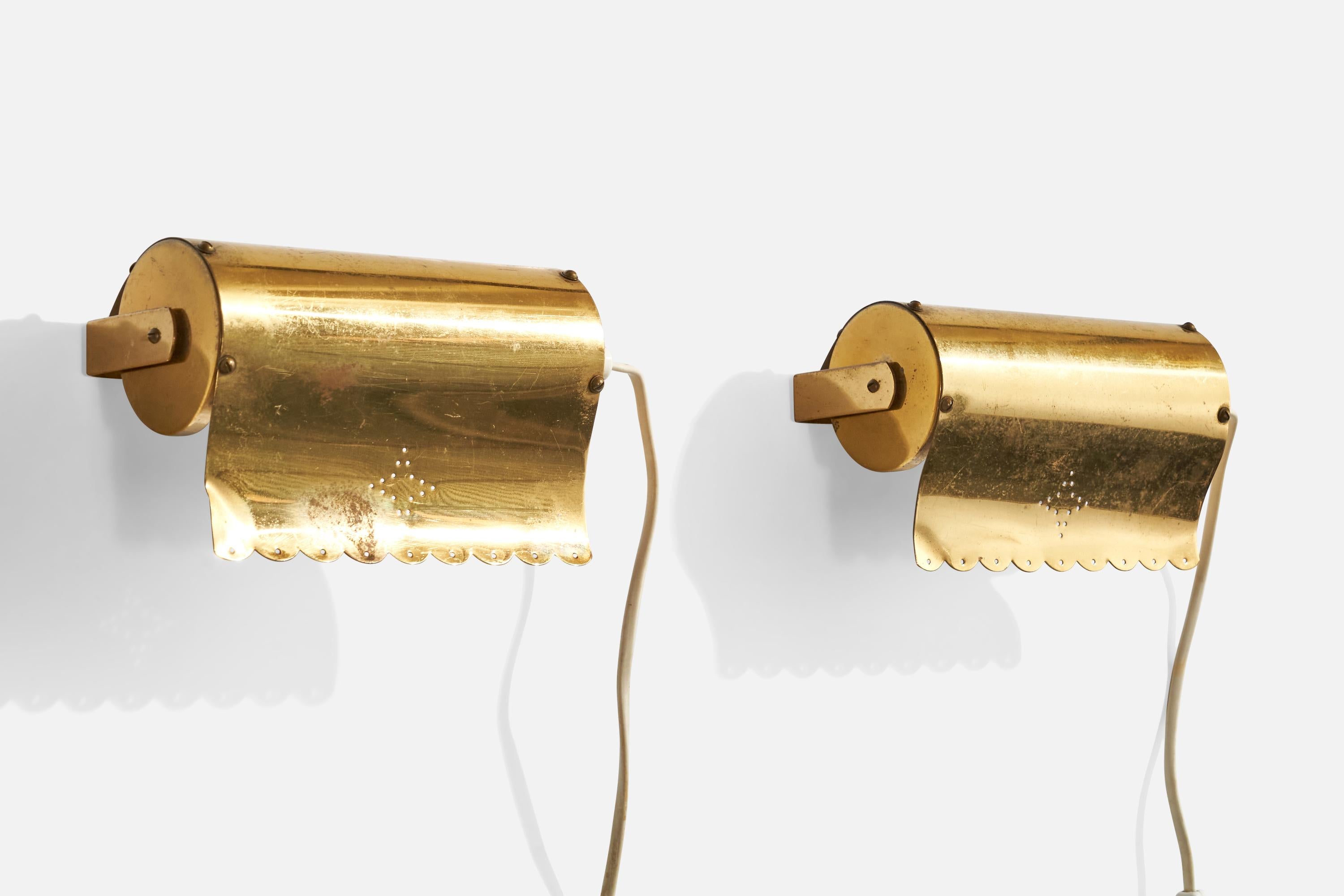 A pair of brass wall lights designed and produced in Sweden, c. 1940s.

Dramatic patina and light denting present.

Overall Dimensions (inches):  4.25” H x 7” W x 6“ D

Back Plate Dimensions (Inches):  1